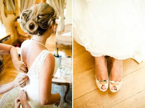 A two-panel getting-ready detail composition shot indoors, likely in a bridal suite or chateau bedroom. The left panel shows the bride from behind as an attendant fastens the back of her ivory lace wedding gown; the bride wears a pearl necklace and an upswept pinned hairstyle with soft rolled curls. The right panel is a close-up detail shot of the bride's feet on a light wood floor, showing ivory peep-toe heels with a bow or heart-shaped embellishment at the toe, with the hem of her white ballgown skirt visible above. Both panels are warmly lit with a soft, golden tone.
