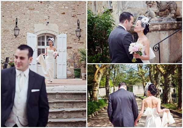 A three-image collage of couple portraits taken outdoors at what appears to be a French chateau or manor estate. The groom wears a charcoal grey suit with a light ivory waistcoat and white pocket square, while the bride wears a strapless fitted ivory gown with a large bow detail at the back, carrying a small bouquet of pale pink and white flowers, and wearing a white feathered birdcage fascinator in her hair. The left image shows a first-look moment on stone steps in front of the chateau's arched doorway with white shutters, captured as a medium wide shot. The top right is a close portrait of the couple facing each other near a stone balustrade with decorative sculpture, showing an intimate moment. The bottom right is a rear-view wide shot of the couple walking hand-in-hand along a tree-lined allee on the chateau grounds, clearly showing the bow detail on the back of the bride's dress. The overall styling is classic and polished with a monochromatic palette. Potential venue feature image.