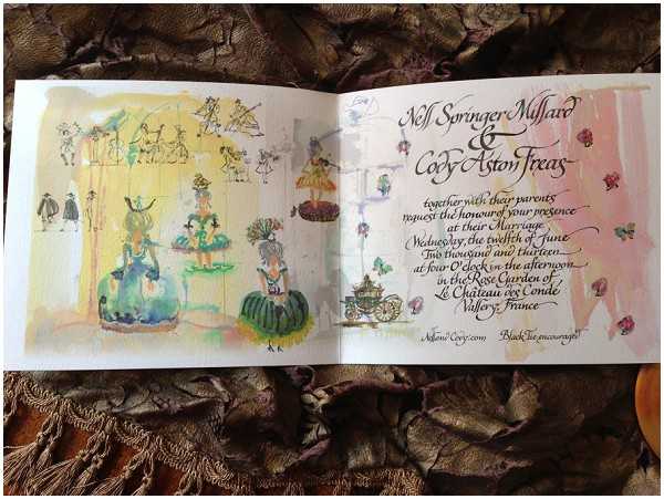 Close-up flat lay of an open wedding invitation booklet for Nell Springer Millard and Cody Aston Treas, placed on a textured bronze and brown fabric surface. The left page features a hand-painted watercolor illustration in a whimsical, vintage carnival or masquerade style depicting costumed figures in green and yellow ball gowns, with a warm yellow wash background. The right page displays calligraphic script text in dark ink on a soft pink-washed background, detailing the wedding date of Wednesday the twelfth of June 2013 at four o'clock in the afternoon, held in the Rose Garden of Le Château des Condé, Vallery, France, with a dress code of black tie encouraged. Small illustrated details including a carriage, flowers, and decorative figures are scattered throughout both pages.
