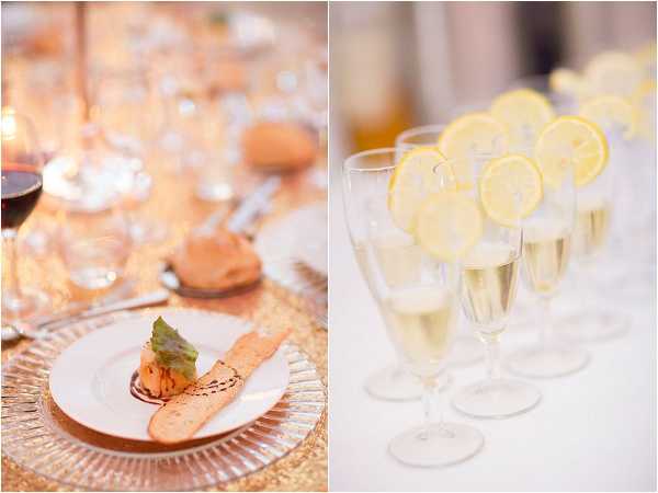 A close-up detail diptych from a wedding reception dinner service. The left panel shows a plated appetizer course — a small molded dish garnished with a green herb leaf and a thin crisp, served on a white plate atop a gold sequin charger, with wine glasses containing red wine and multiple crystal glasses visible along the table runner in soft candlelight. The right panel shows a row of champagne flutes filled with sparkling wine, each garnished with a fresh lemon slice on the rim, lined up on a white linen-covered surface. The overall decor palette is warm gold and white, with a classic, formal reception styling.