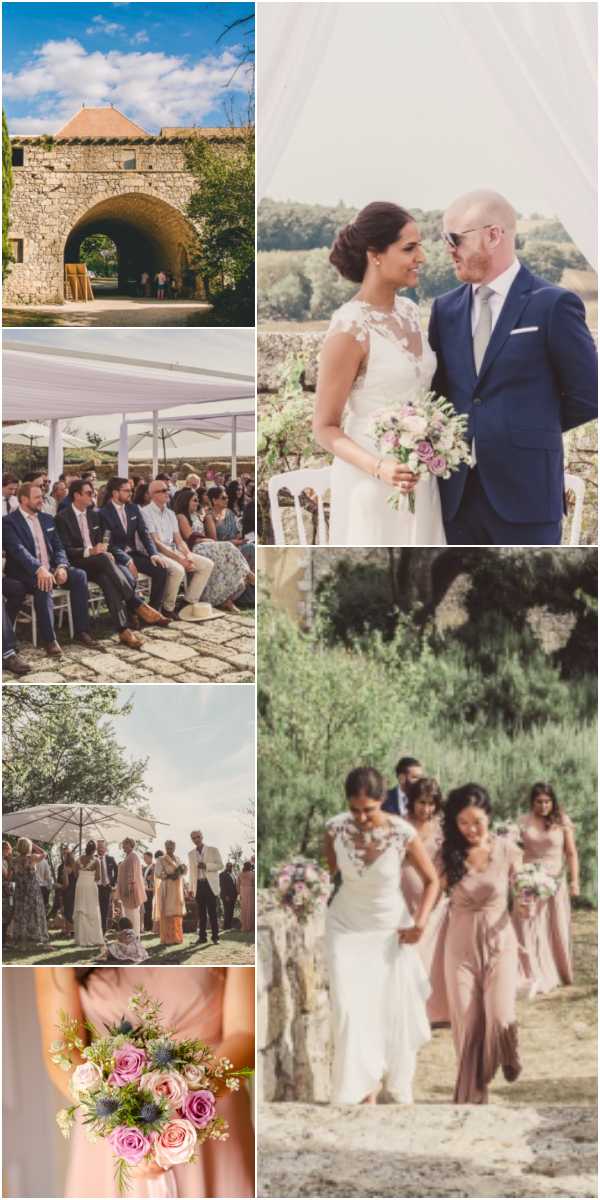 A collage of six images from an outdoor French countryside wedding at a stone chateau venue. The top-left wide shot shows the venue's large stone archway entrance with guests visible in the background — a classic rustic French property. Potential venue feature image. The top-right couple portrait shows the bride in a fitted white lace cap-sleeve gown with illusion neckline holding a bouquet of pink roses, lavender, and greenery, standing with the groom in a navy suit with a grey tie, shot against an outdoor backdrop with white draping. The middle-left wide shot captures seated guests during an outdoor ceremony under a white fabric canopy and large market umbrellas on a stone-paved terrace. The middle-right wide shot shows the bride walking with bridesmaids in dusty rose floor-length dresses along a sandy path through an olive grove, with additional guests visible behind. The bottom-left mid-shot shows guests mingling on a lawn under a large white parasol during what appears to be the cocktail hour. The bottom detail close-up features a bridesmaid holding a small bouquet of pink roses, blue thistle, and mixed greenery tied with a dusty rose ribbon. The overall styling palette is dusty rose, navy, and ivory with a rustic French countryside aesthetic.