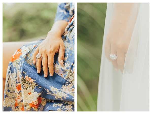 A diptych of two close-up detail shots showcasing the same engagement or wedding ring — a round diamond or crystal center stone surrounded by a halo of smaller stones in a starburst or floral setting on a silver-toned band. The left image shows the ring on a woman's hand resting on a blue floral-patterned fabric garment with orange and cream botanical motifs. The right image shows the ring against a sheer white fabric, likely a bridal veil or wedding dress. Both shots are softly lit with a light, airy exposure style.