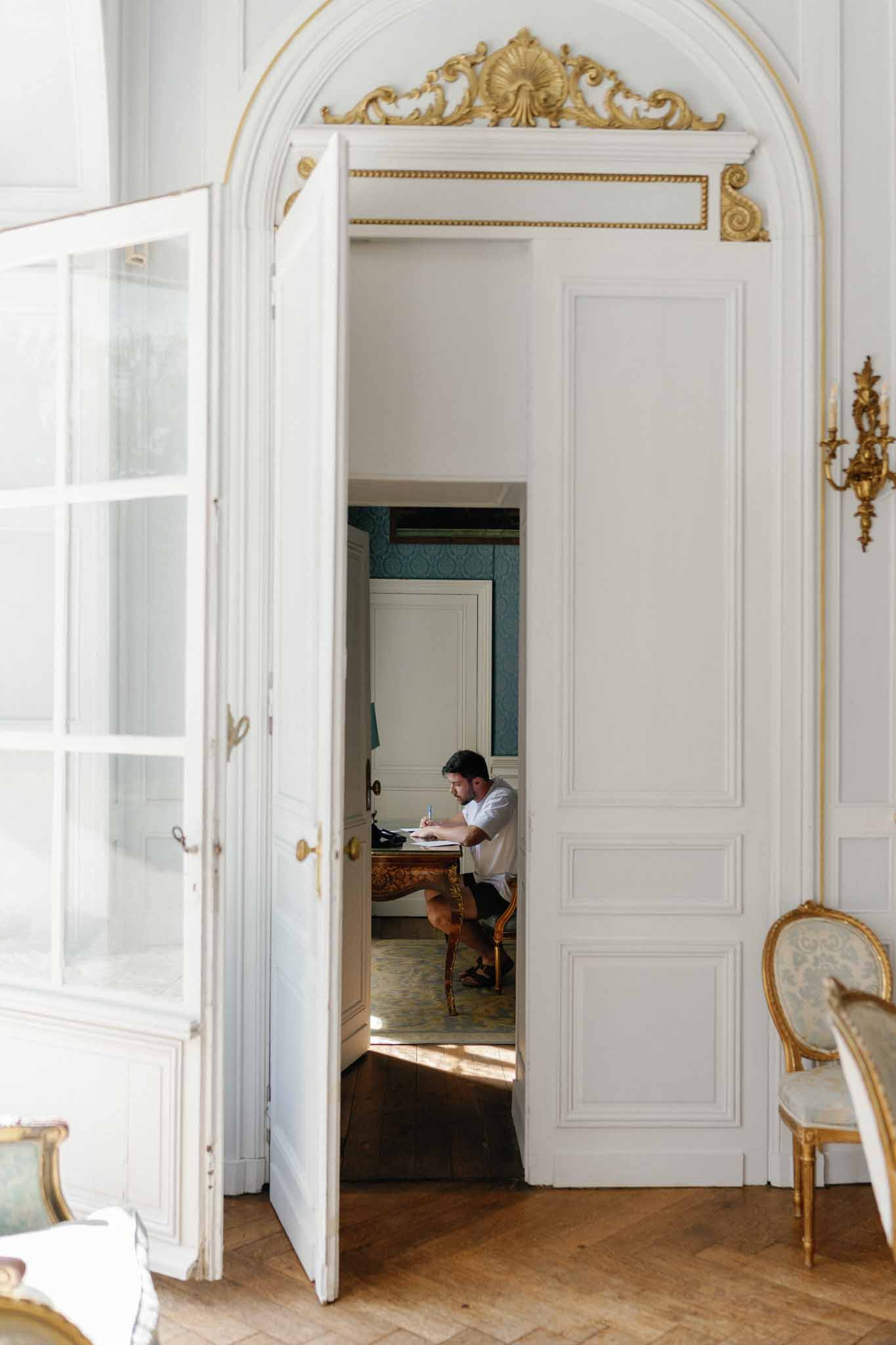 Classical French interior with ornate doorways and period details at elegant wedding venue