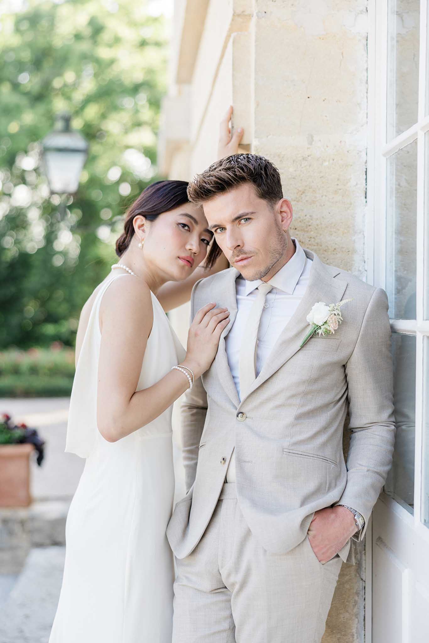 Bride and groom portrait in grounds of Chateau de Courtomer photographed by Pascal Vo
