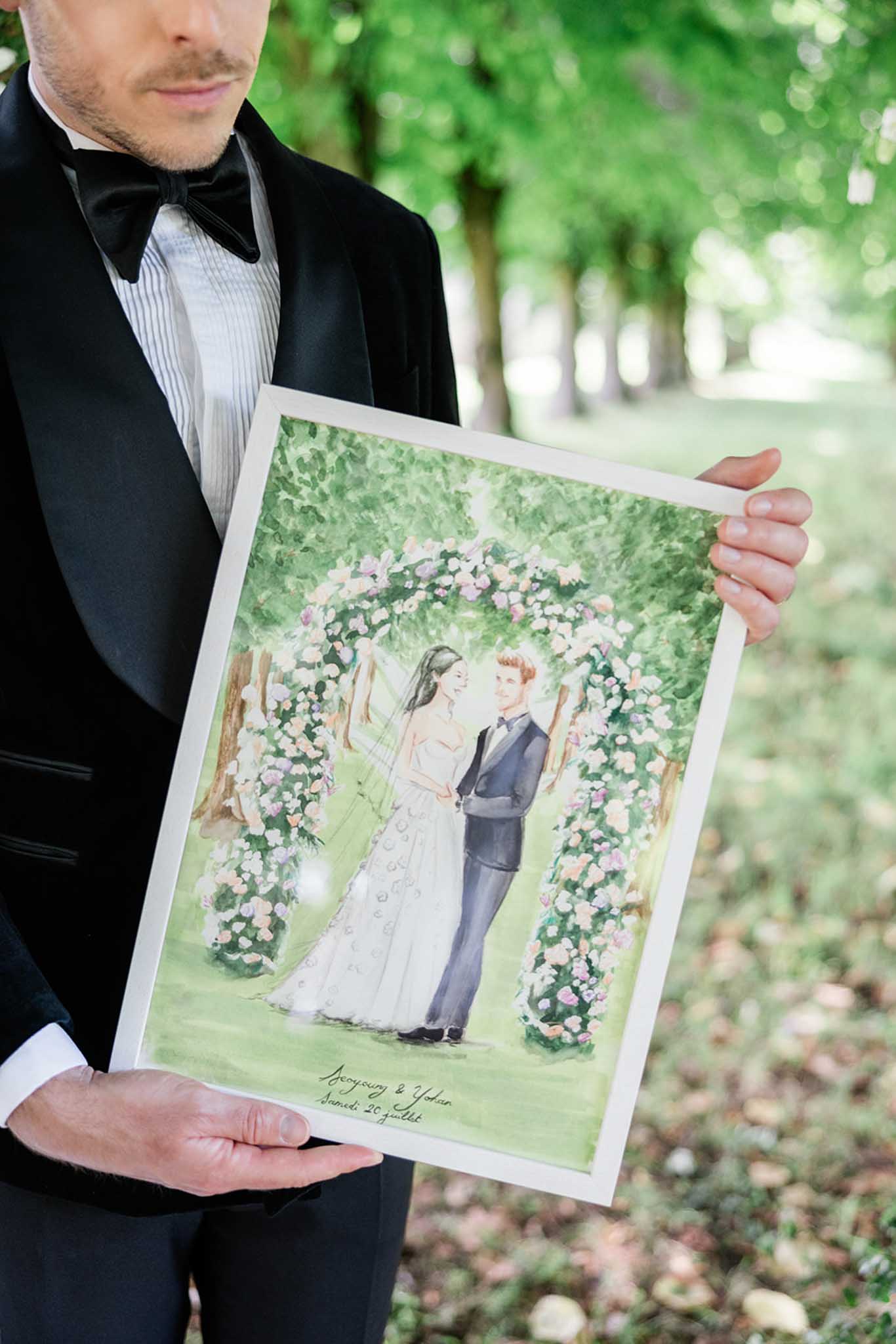 Bride and groom in a garden at their French wedding venue