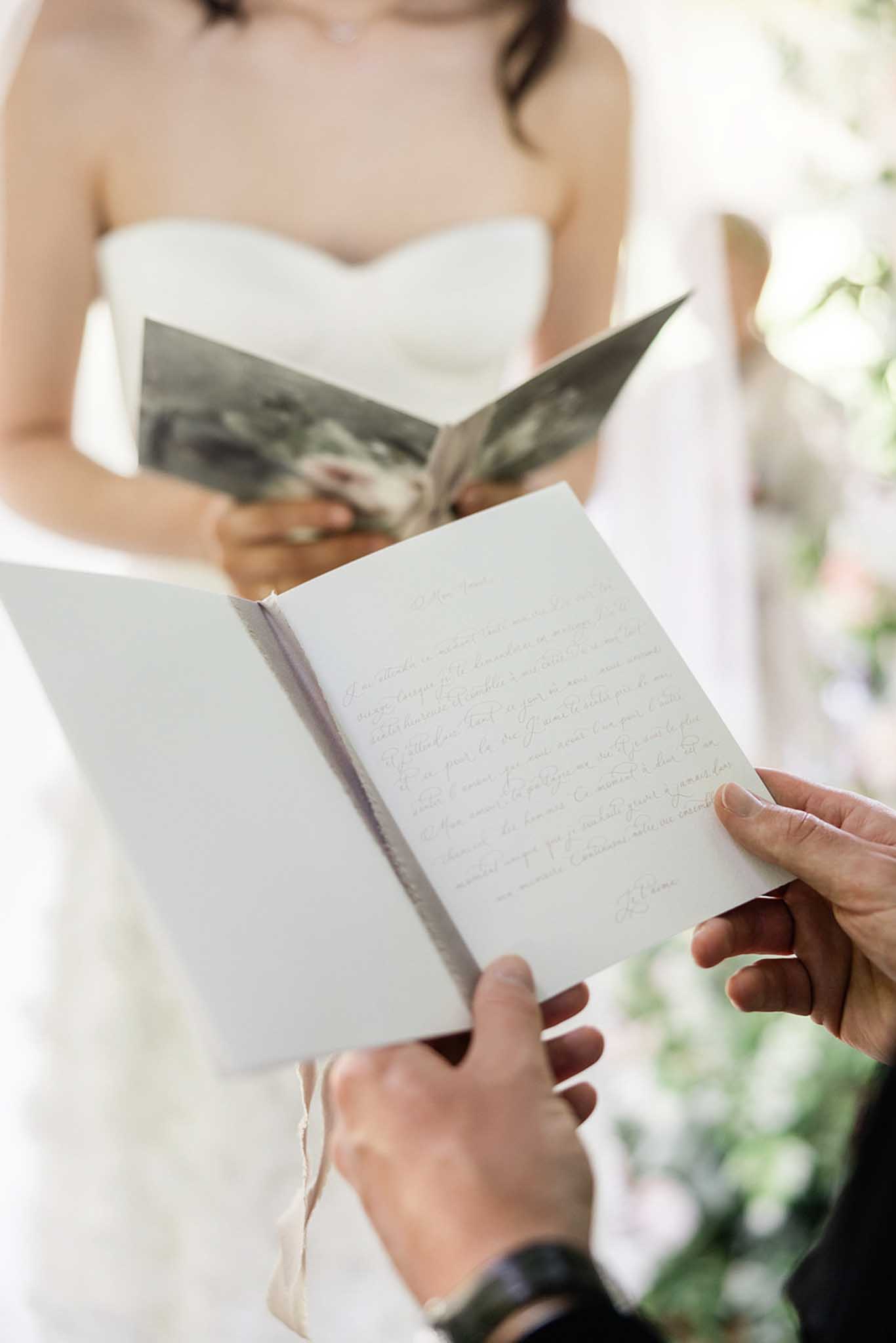 Outdoor ceremony setup in courtyard of Château de Courtomer with guests seated