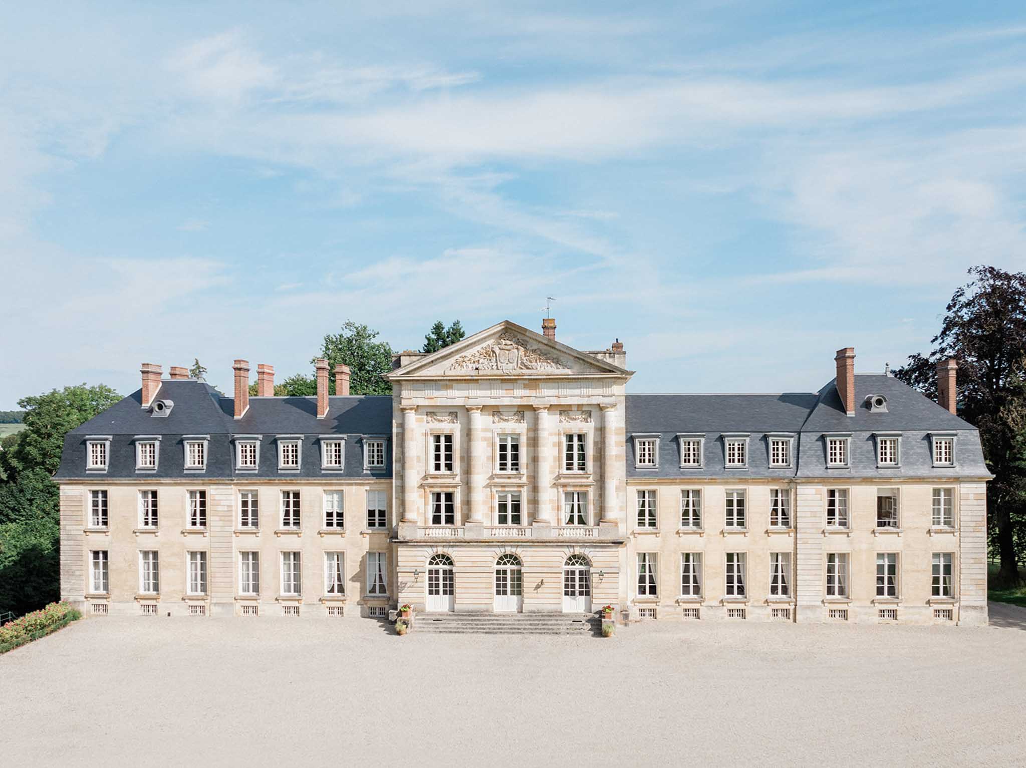 Bride and groom portrait in the grounds of Chateau de Courtomer photographed by Pascal Vo