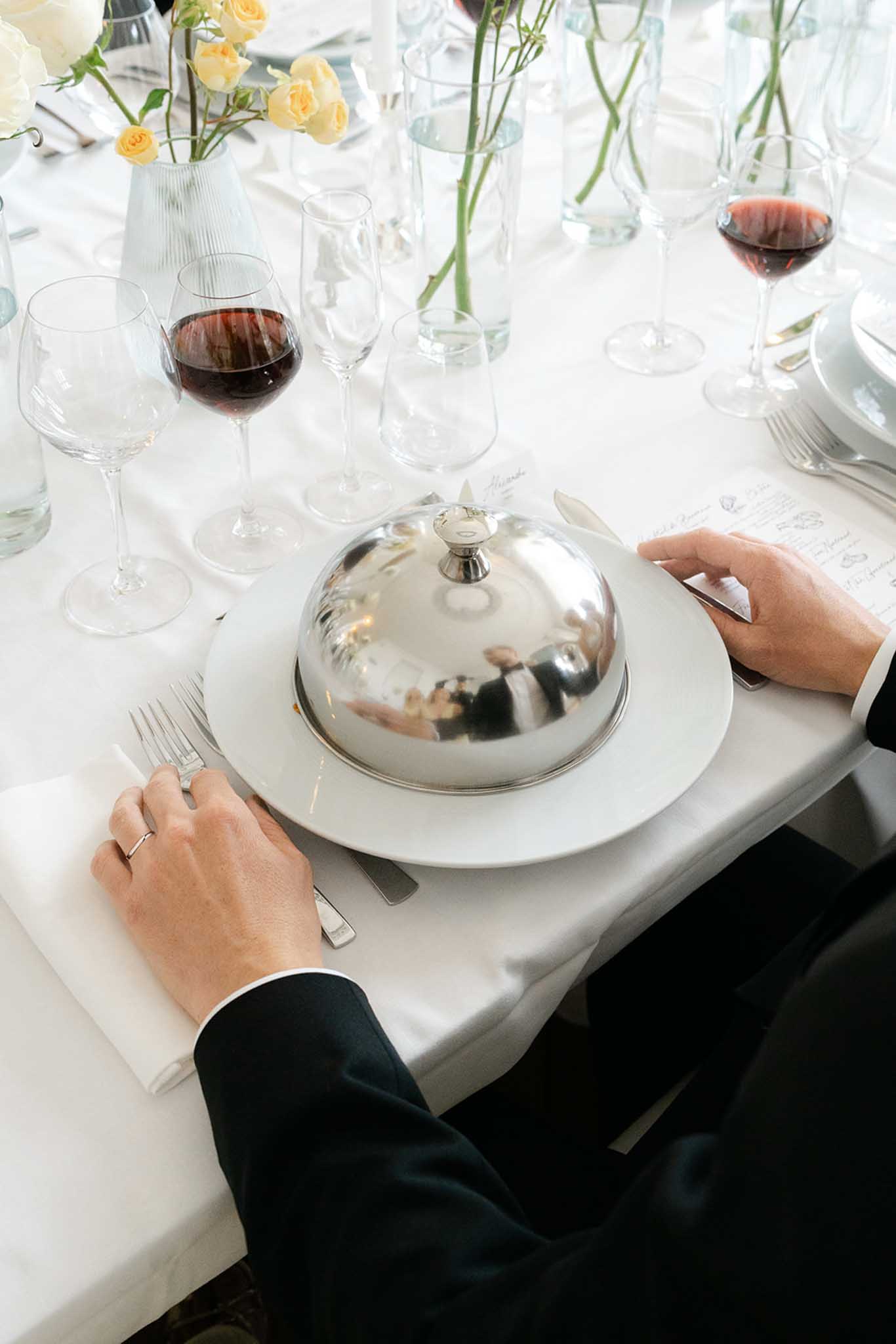 Outdoor ceremony at Château de Garennes with guests seated in garden rows