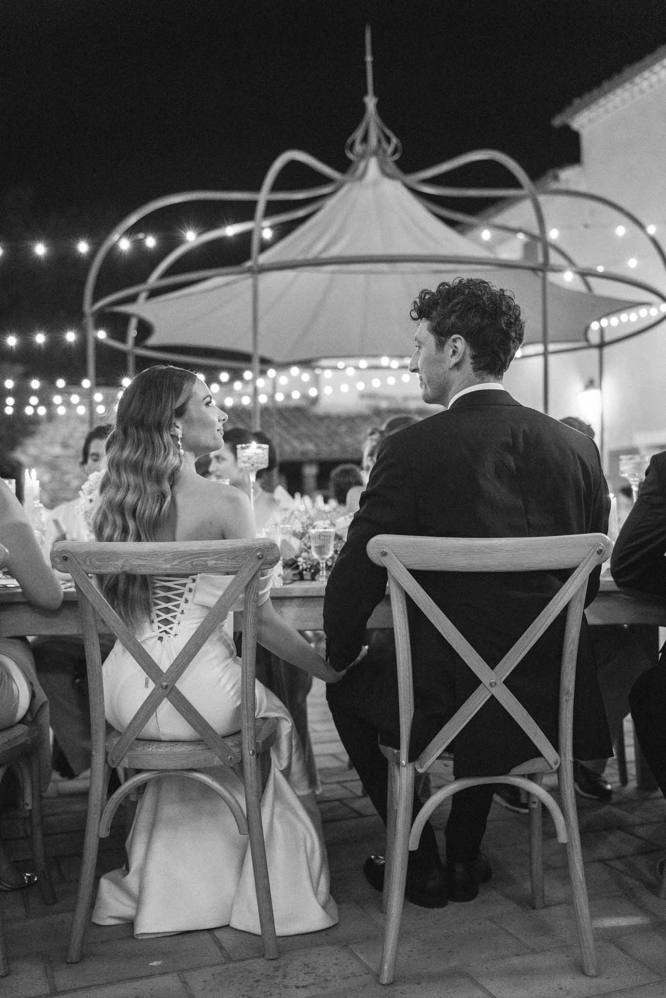 Outdoor reception dining table at Château Les Crostes with white floral arrangements and greenery