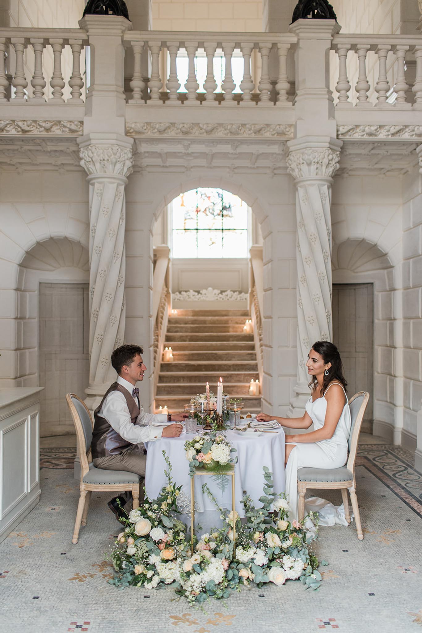 Intimate wedding ceremony inside Chateau de Londigny with guests seated