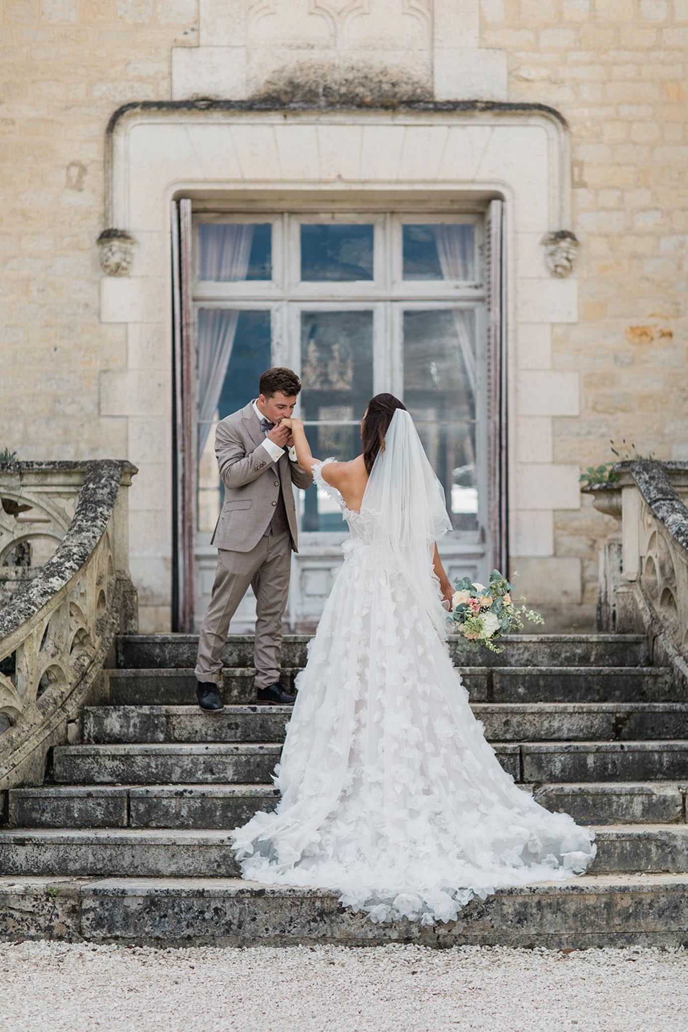 Intimate wedding ceremony inside Chateau de Londigny with guests seated in rows