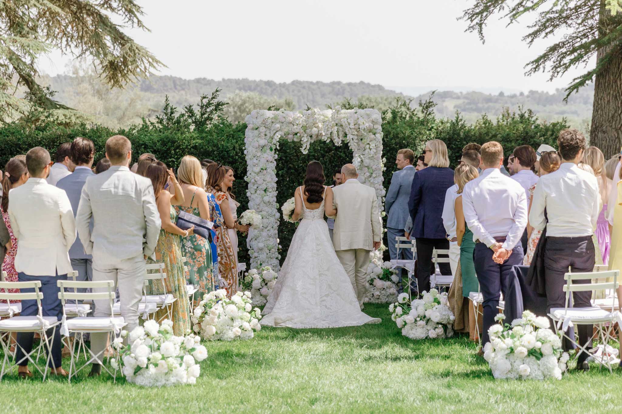 Outdoor garden wedding ceremony at a French chateau