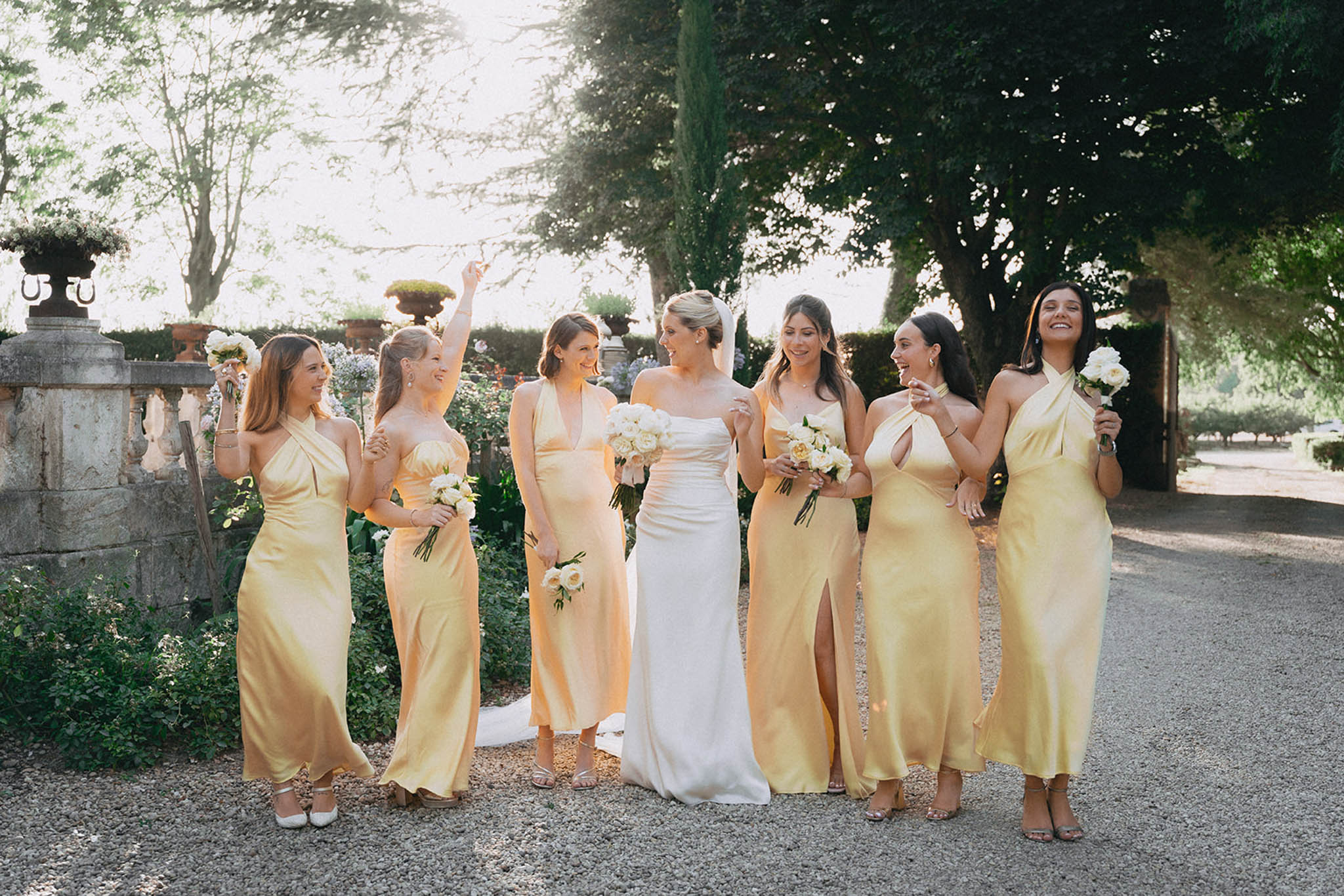 Bride with her bridesmaids in a garden setting