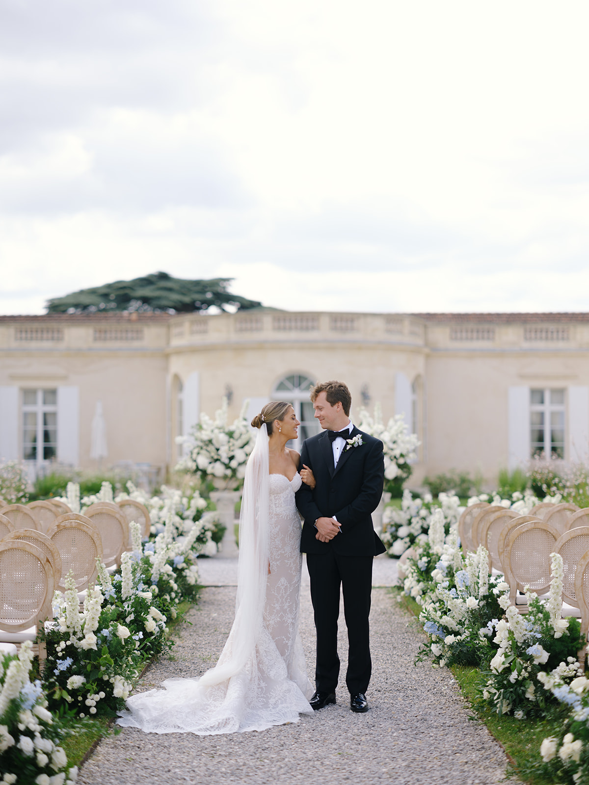 Bride and groom walking together through the venue grounds