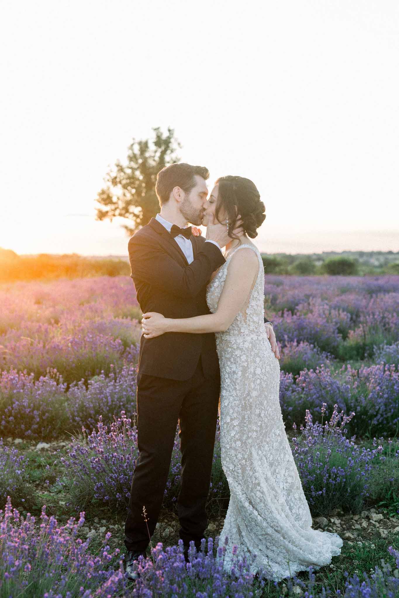Bride and groom sharing a kiss outdoors