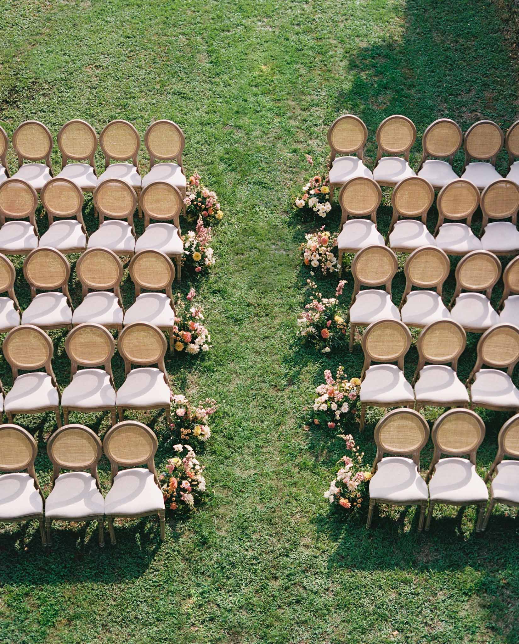 Wedding ceremony setup with floral decorations outdoors