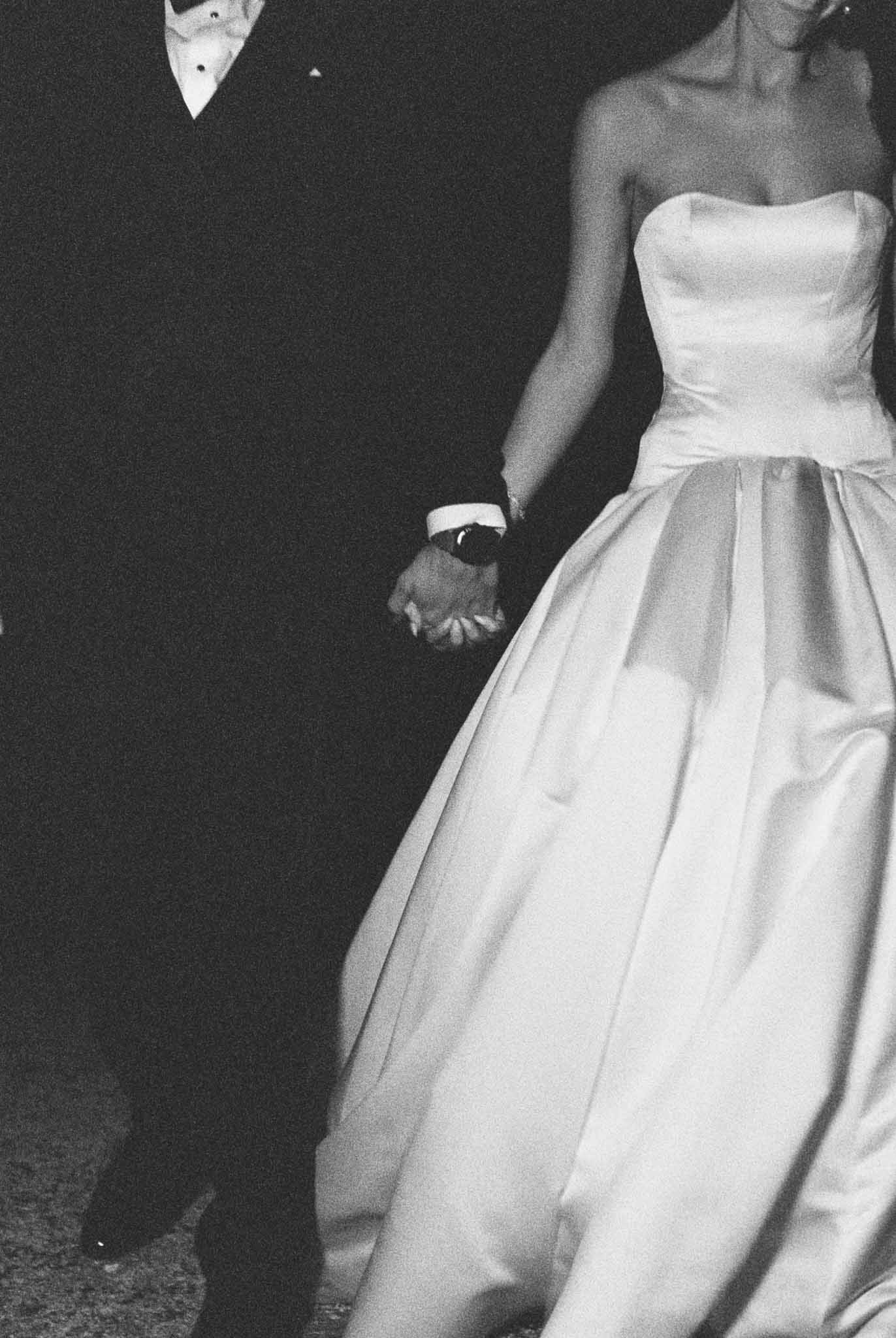 Bride and groom holding hands in the grounds of Château de Jalesnes, Loire Valley