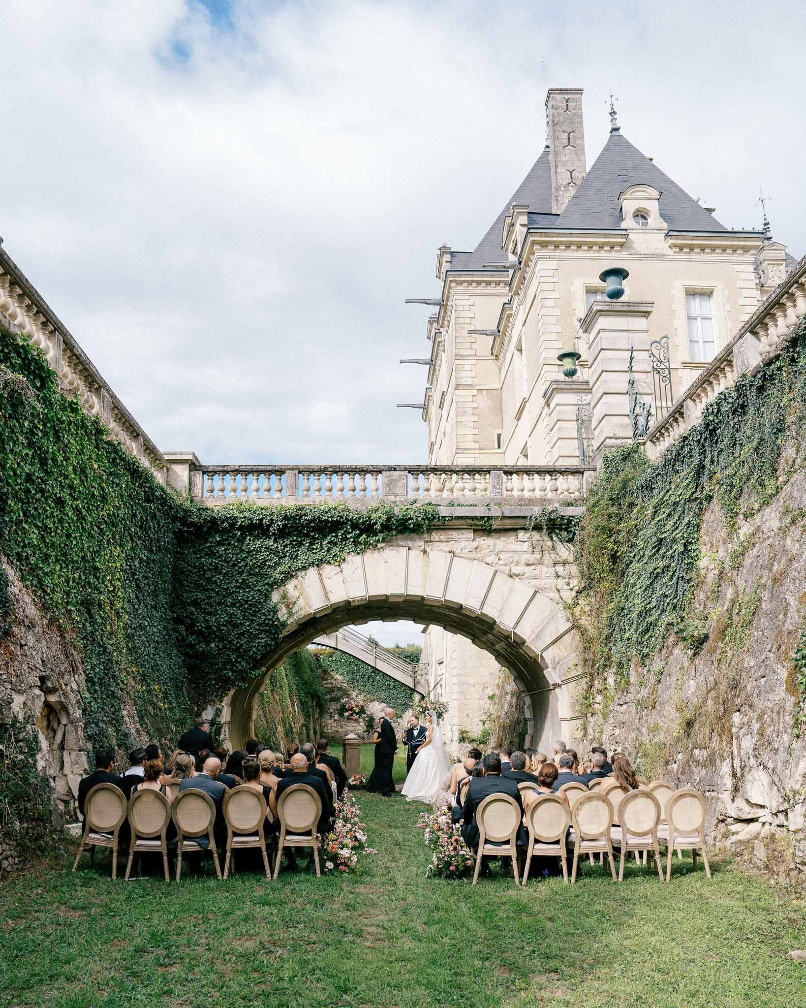 Wedding ceremony setup with floral decorations outdoors