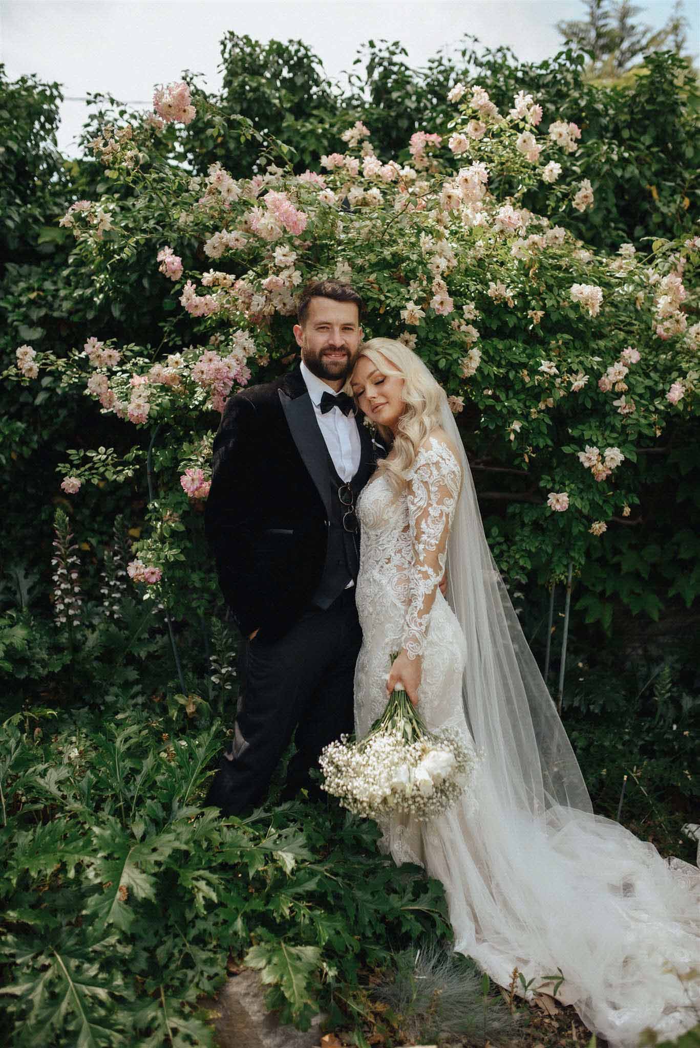 Bride and groom portrait in a garden setting