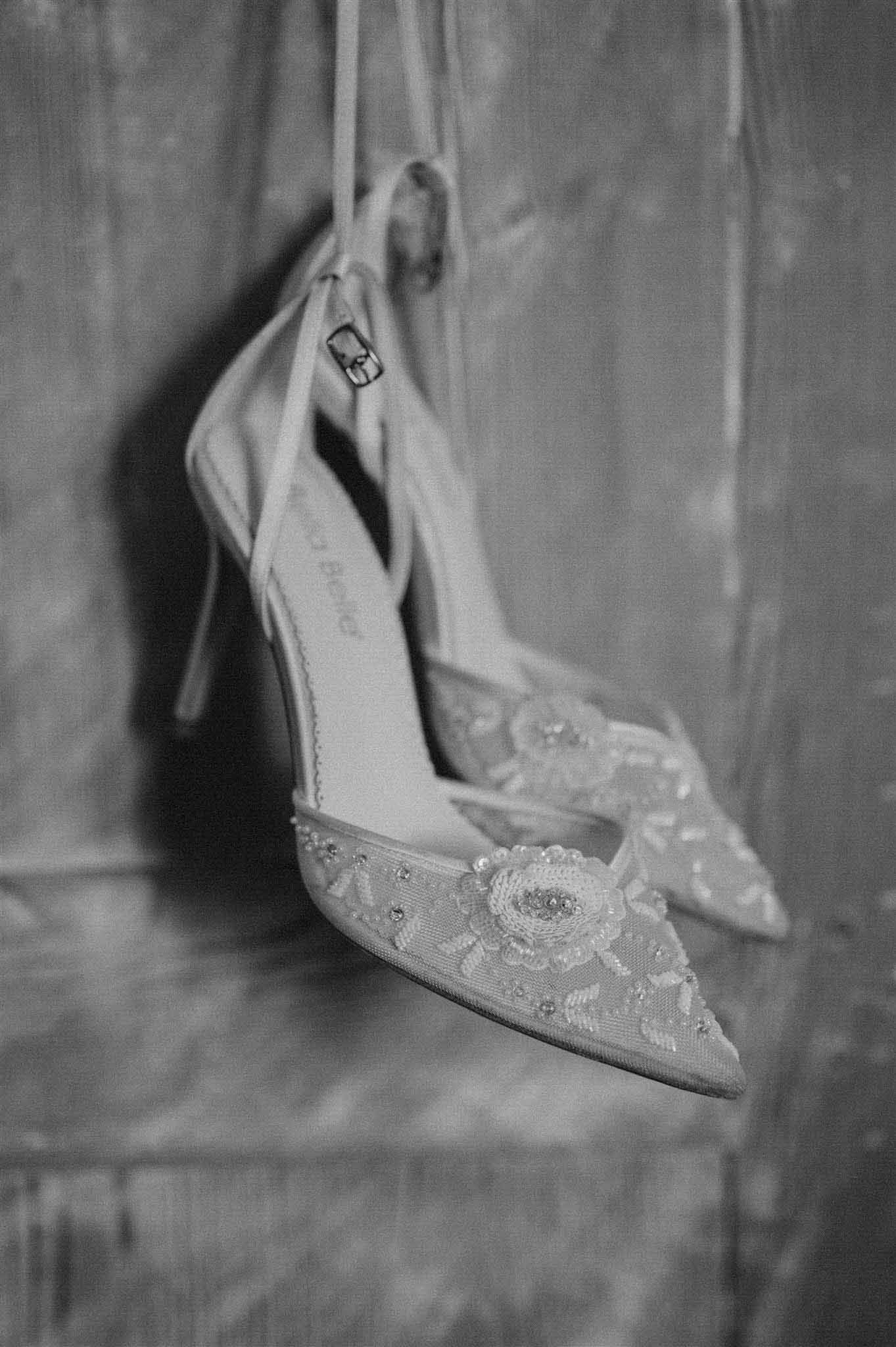 Close-up of pointed bridal shoes at Chateau du Puits-es-Pratx photographed by C Sweden