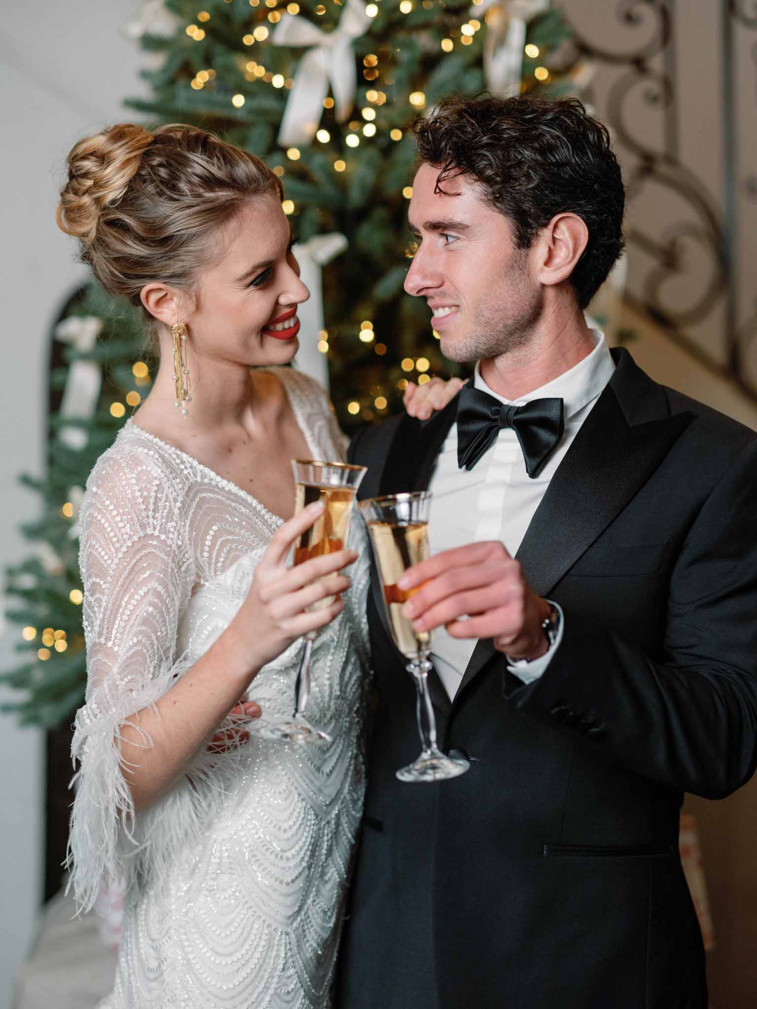 Bride and groom looking at each other while holding wine glasses at Château Marcellus cocktail hour