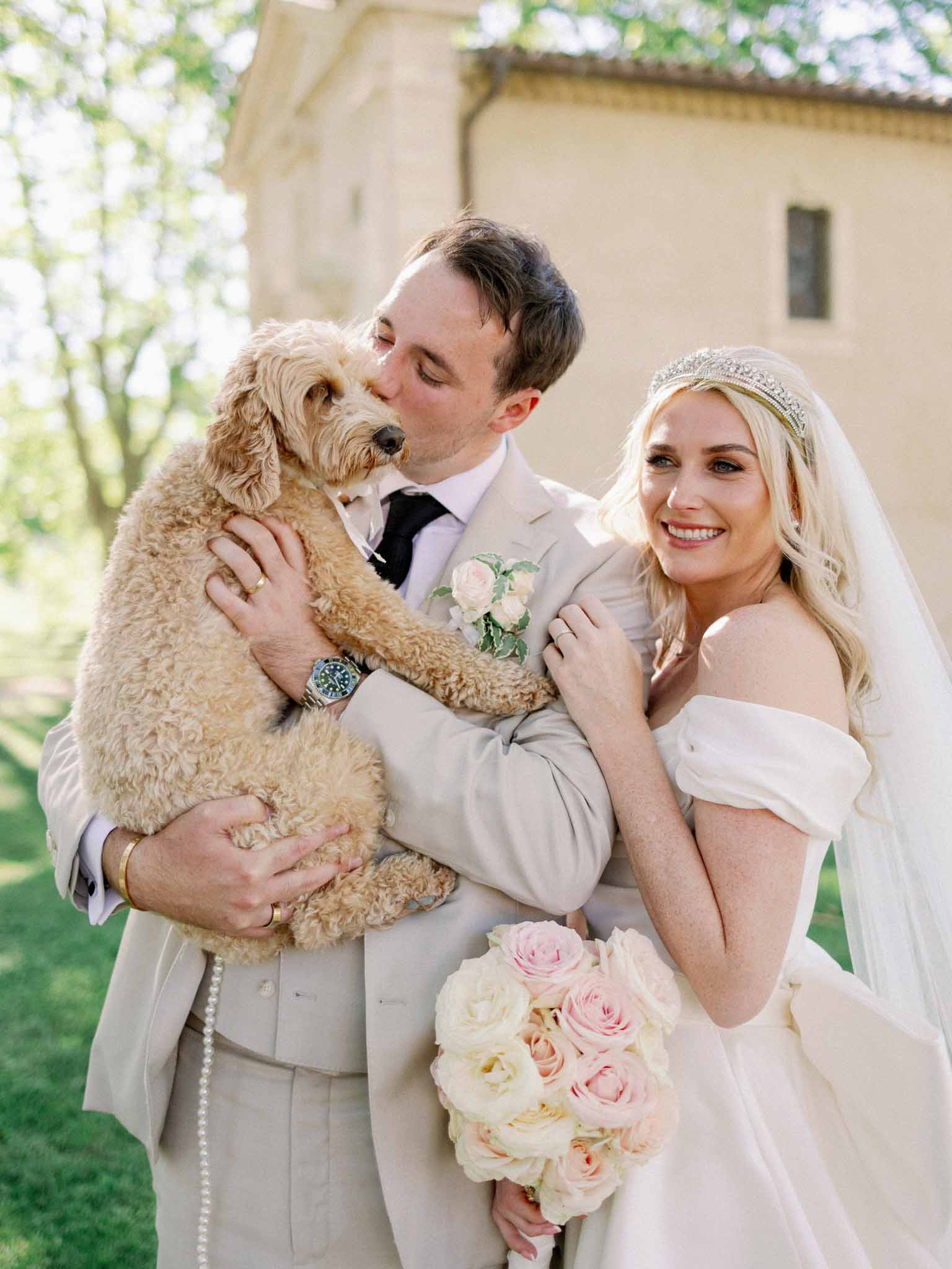 Bride and groom sharing a kiss outdoors
