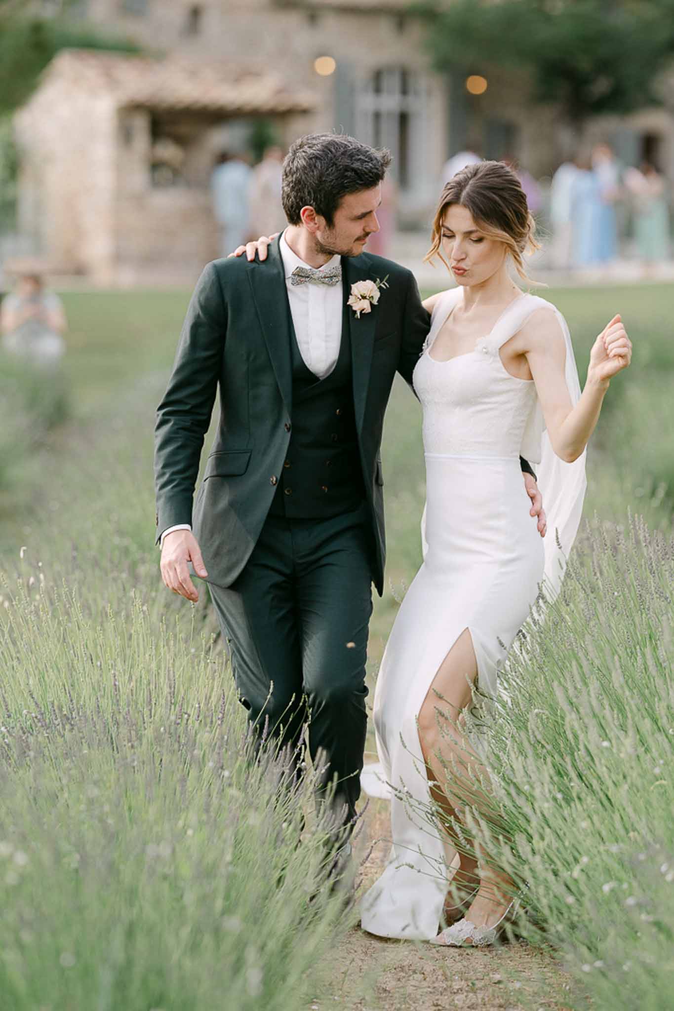 Bride and groom cutting a strawberry round cake at Mas de la Rose France wedding reception