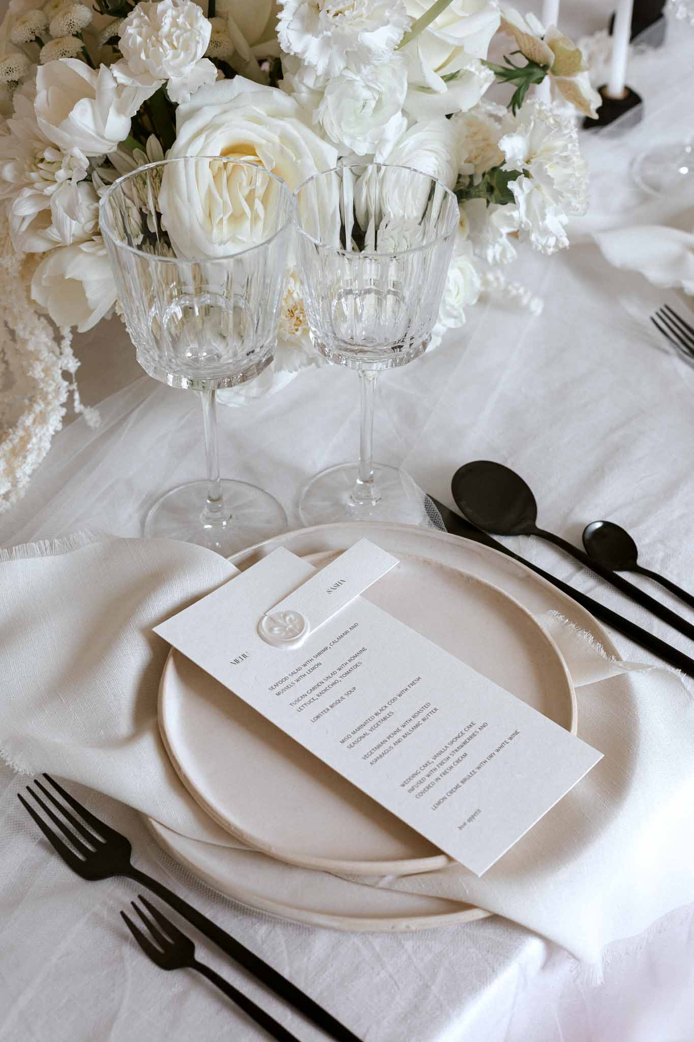 Winter wedding reception scene at Manufacture de Lectoure with guests and candlelit tables