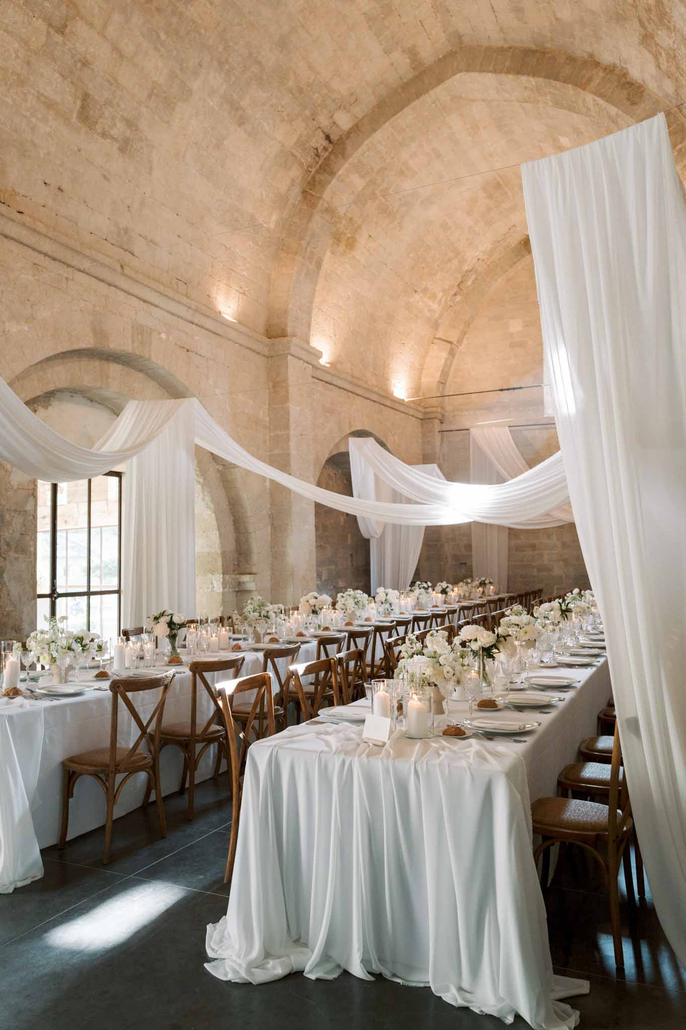 Wedding reception table setting with white roses
