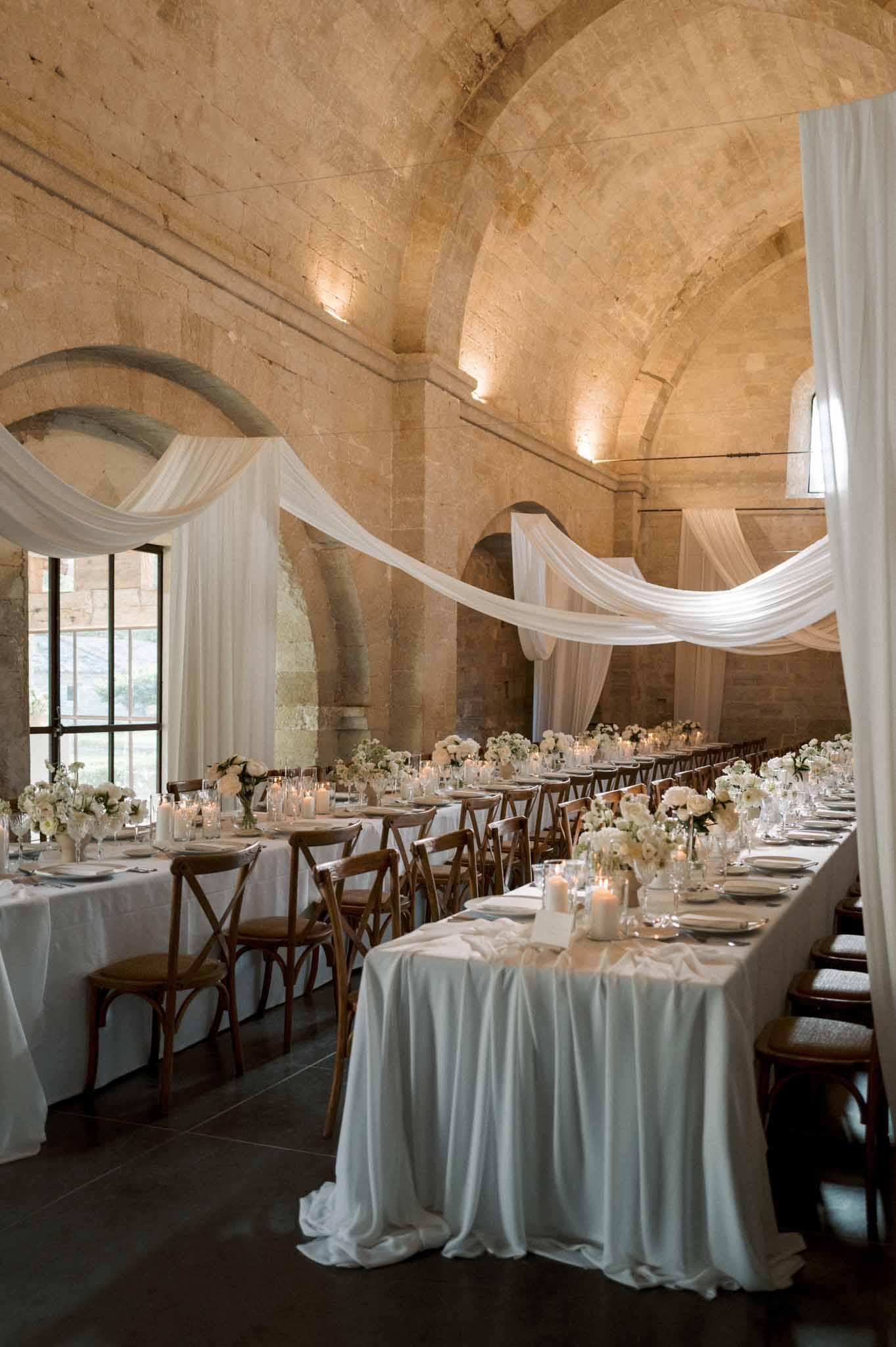 Wedding reception table setting with white roses