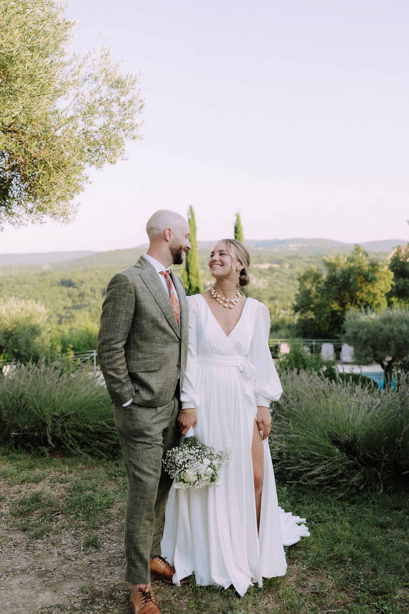 Bride and groom portrait in Mediterranean countryside with lavender and olive trees