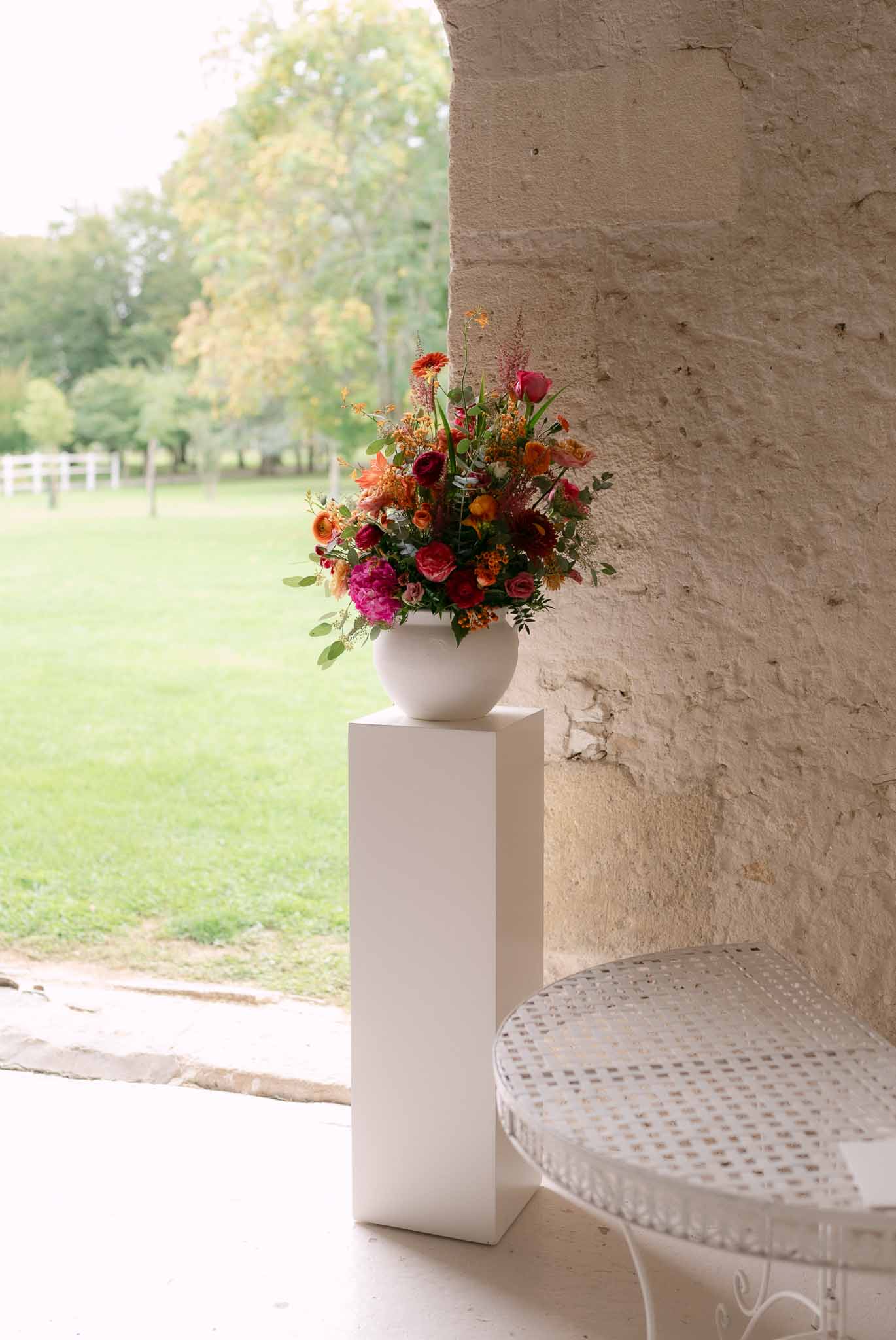 Wedding rings in a garden with white roses