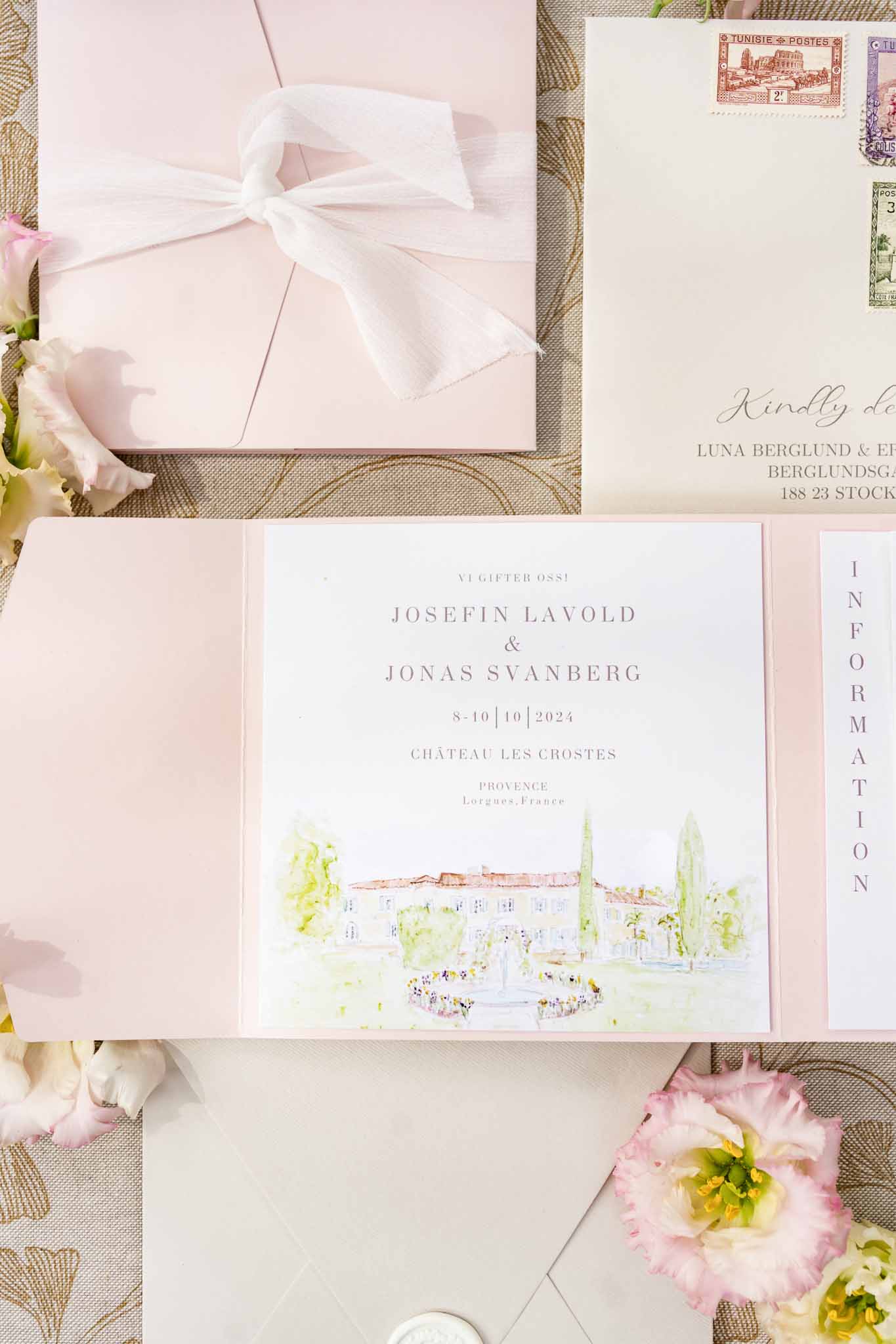 Wedding invitation suite with pink peonies arranged on textured surface for Château Les Crostes wedding