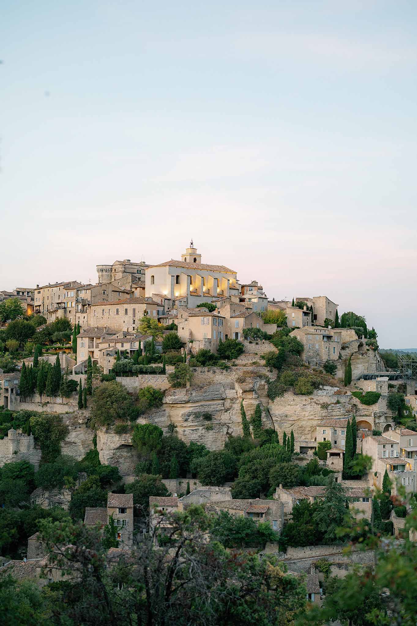 Medieval hilltop village with stone church and cypress trees in Provence wedding destination
