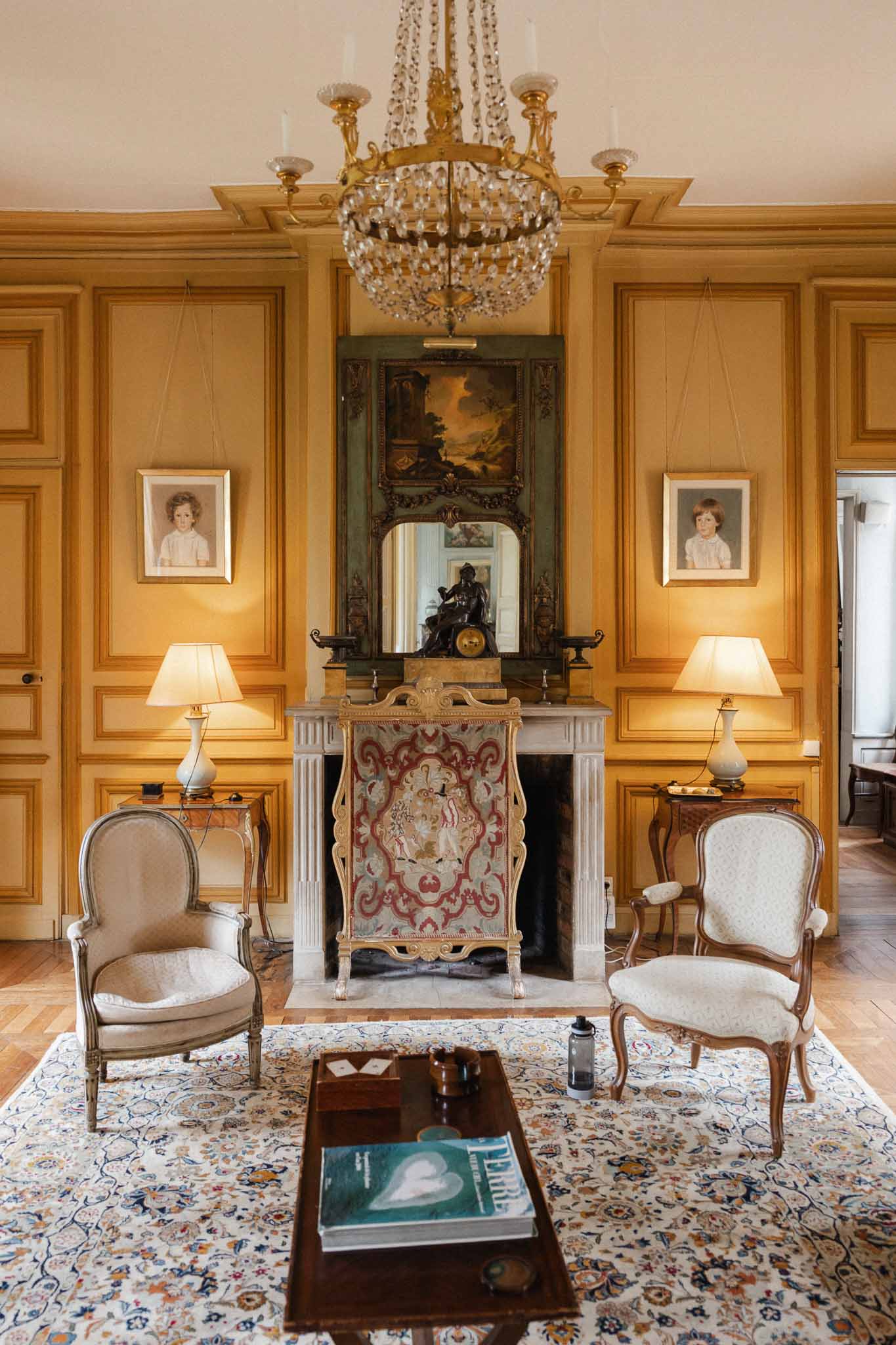 Classical French château interior room with golden paneled walls and period furnishings for weddings
