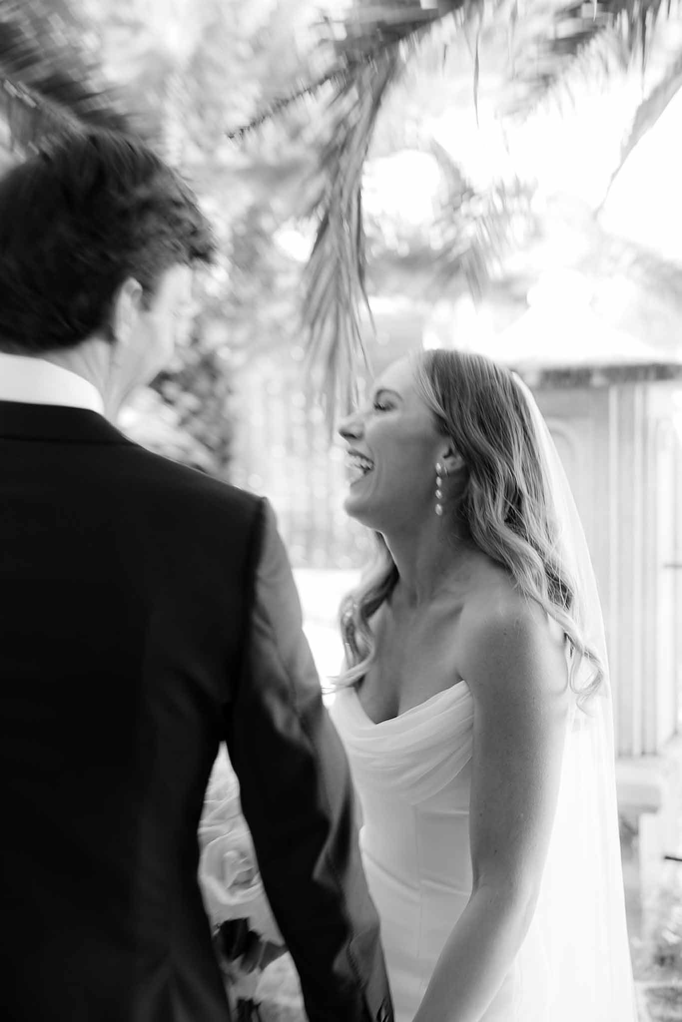 Bride and groom intimate first look moment in elegant indoor venue with classical architecture