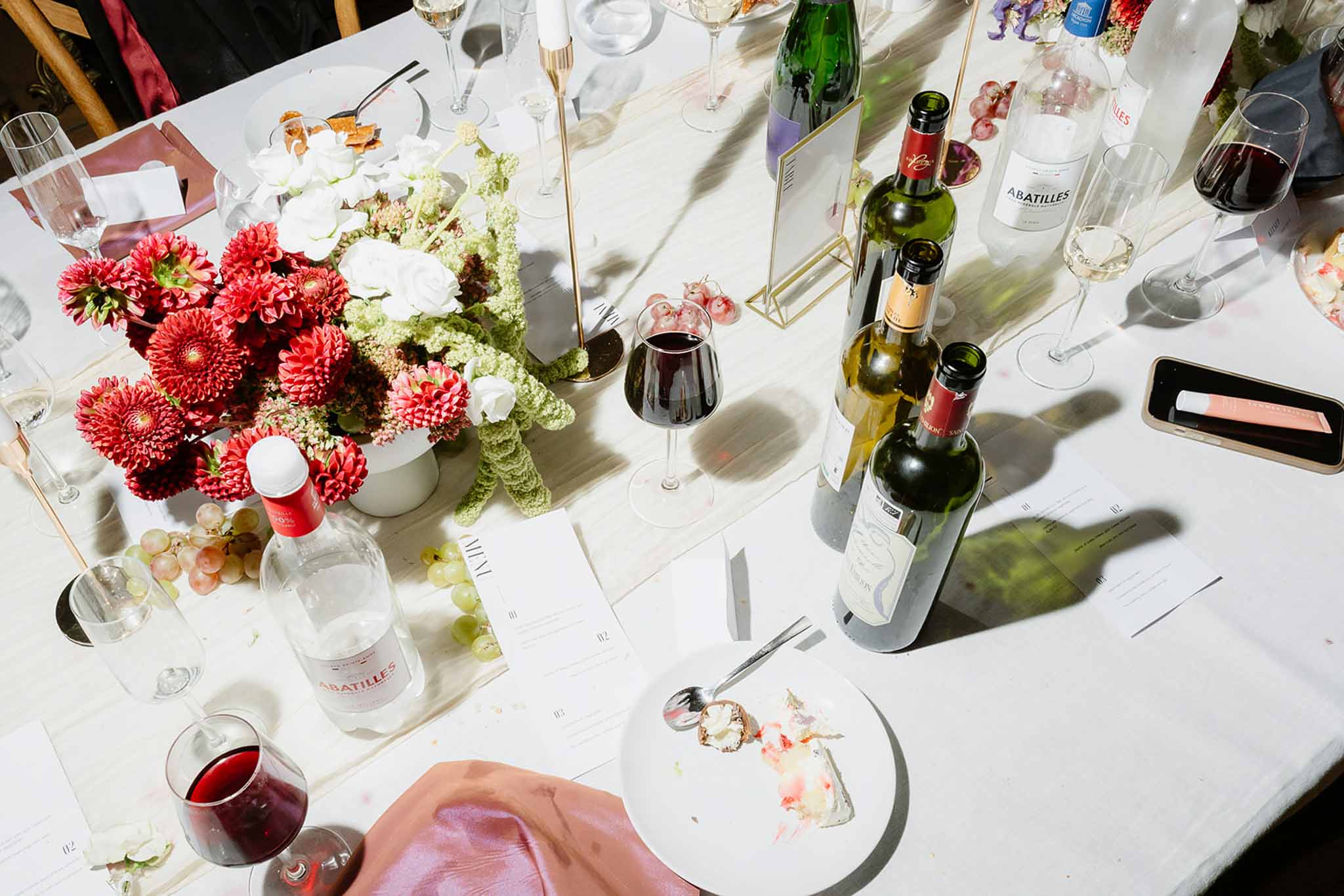 Wedding reception table setting with white roses