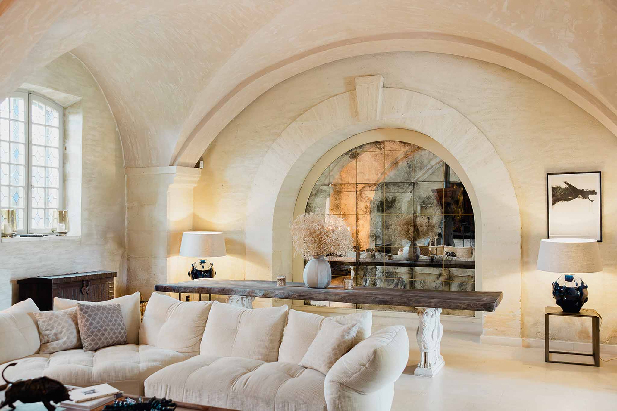 Luxurious interior lounge space with vaulted ceiling and curved seating at upscale wedding venue