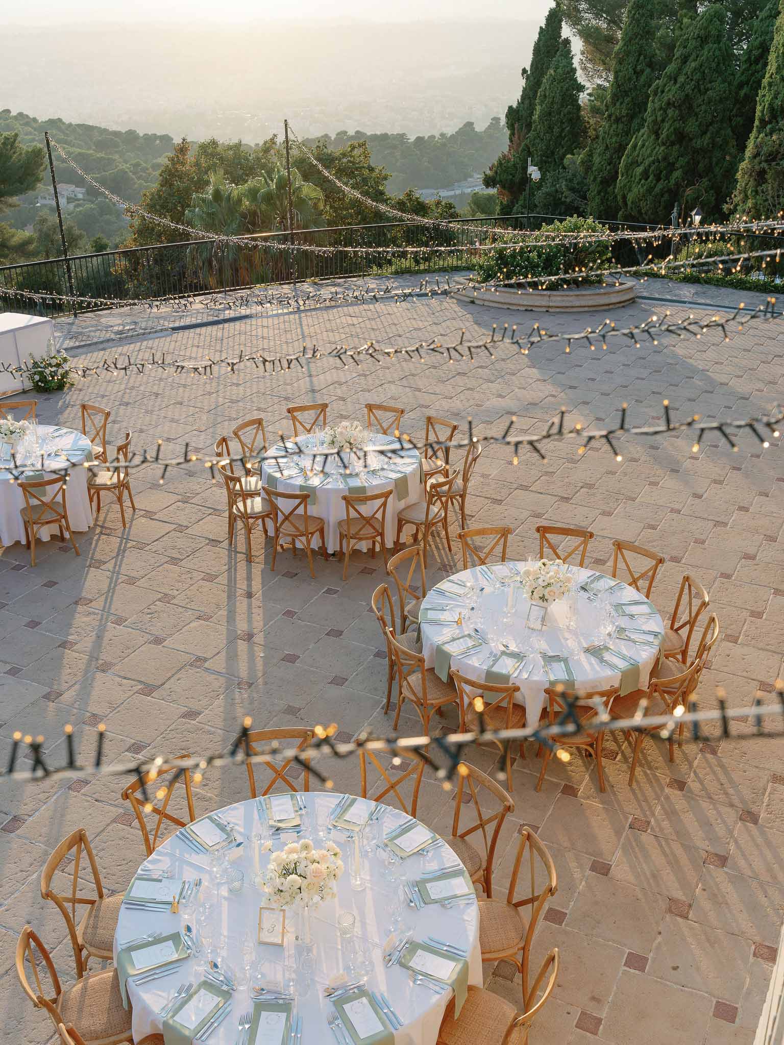 Aerial view of outdoor reception terrace with mountain views at luxury wedding venue