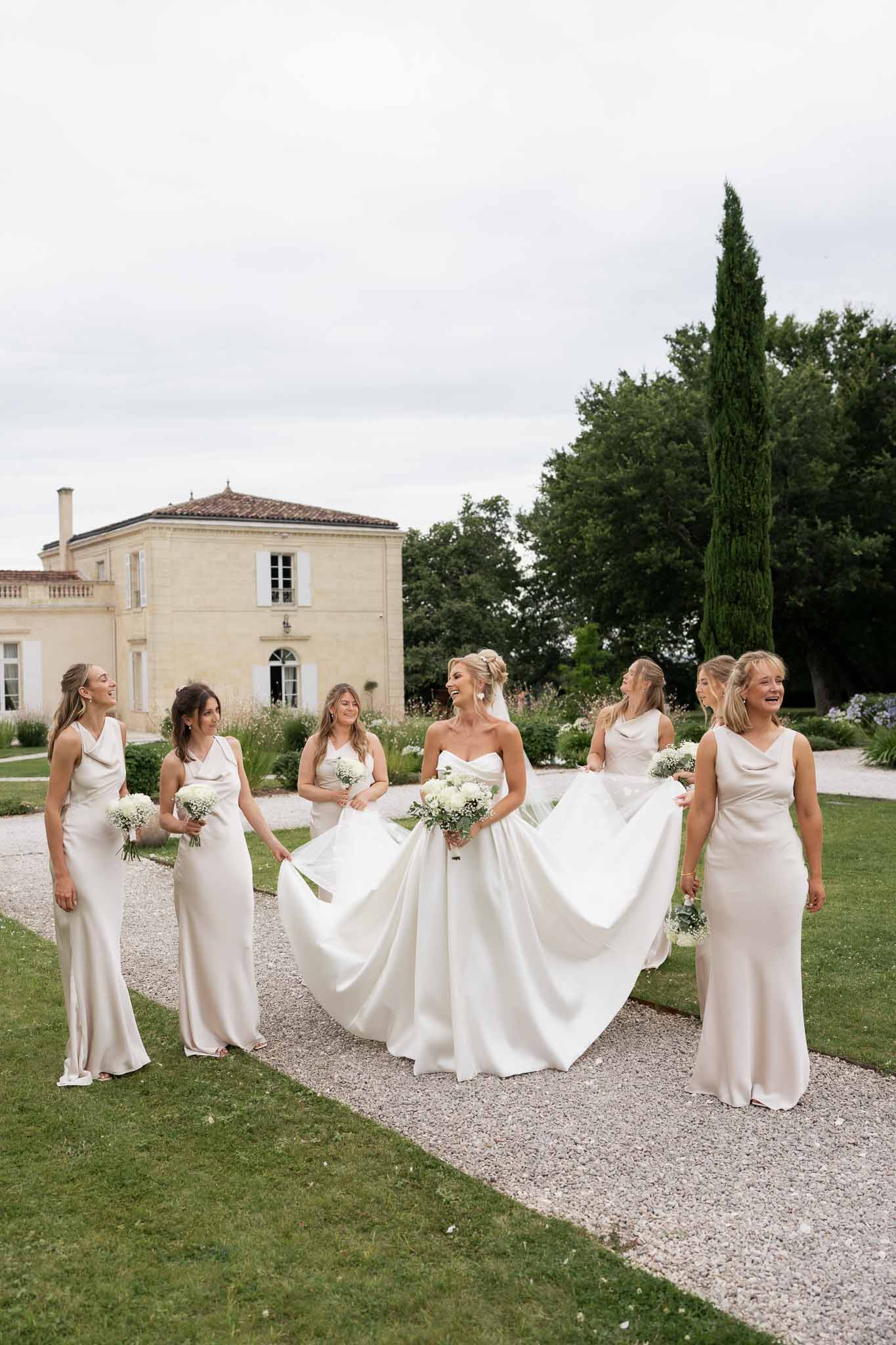 Bridal party portrait with bride and bridesmaids at French estate mansion