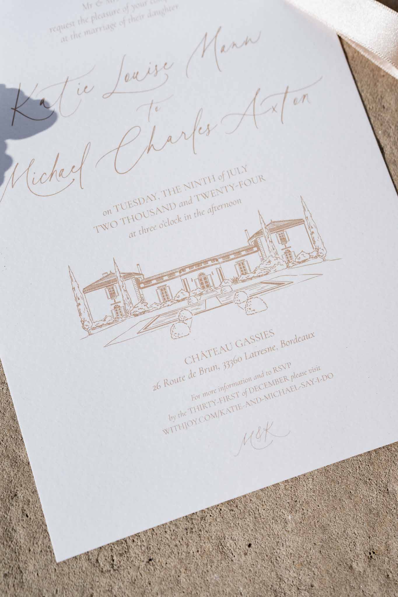 Wedding invitation with rose gold lettering and Château Gassies illustration on cream cardstock