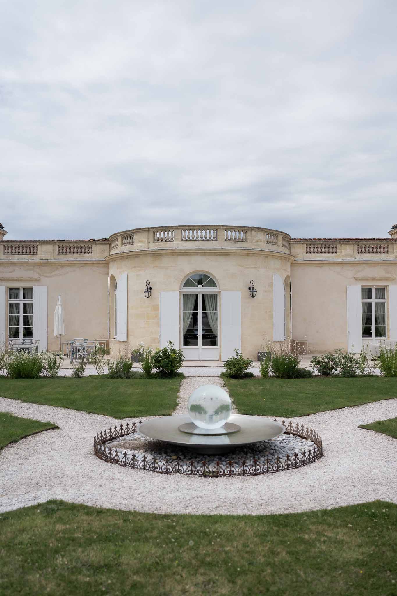 Classical French château with formal gardens and fountain at elegant wedding venue