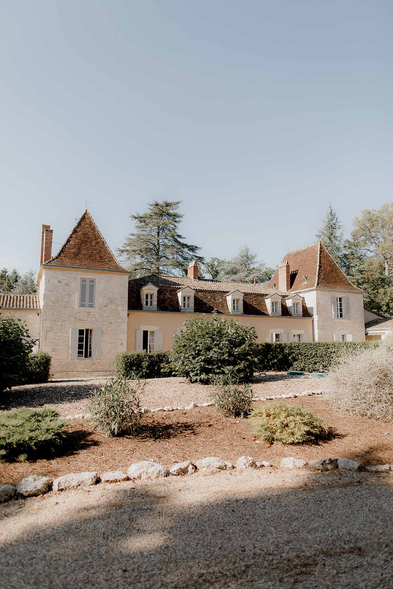 French château exterior with turrets and manicured gardens at luxury wedding venue