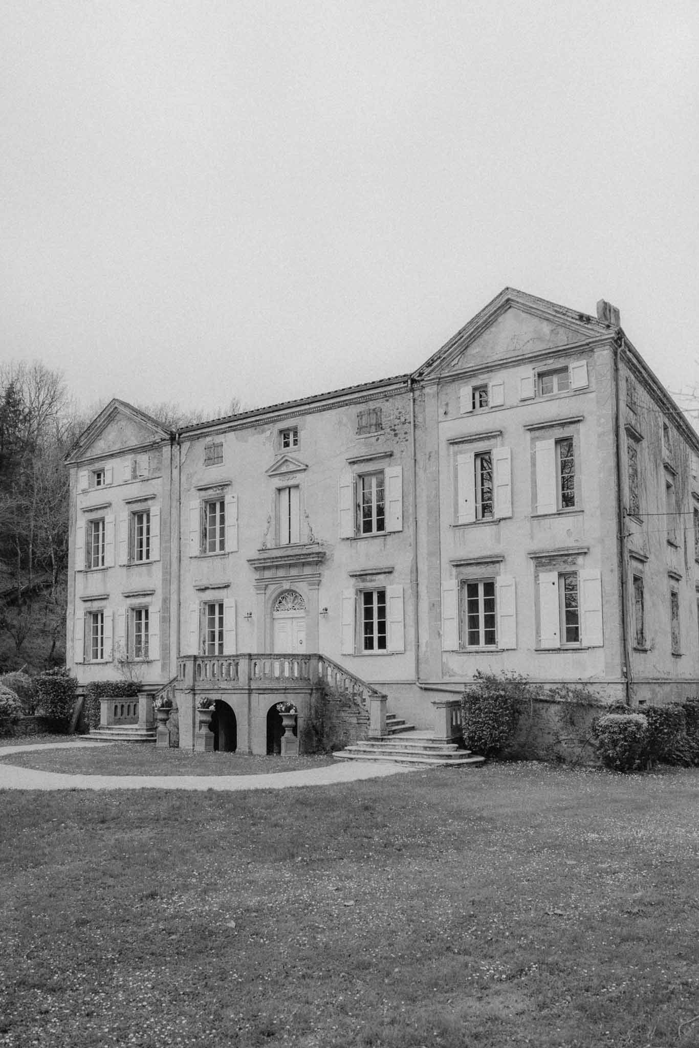 Neoclassical mansion exterior with symmetrical architecture and stone facade at historic wedding venue