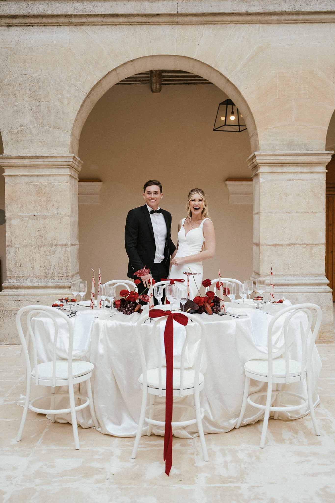 Wedding reception table setting with white roses