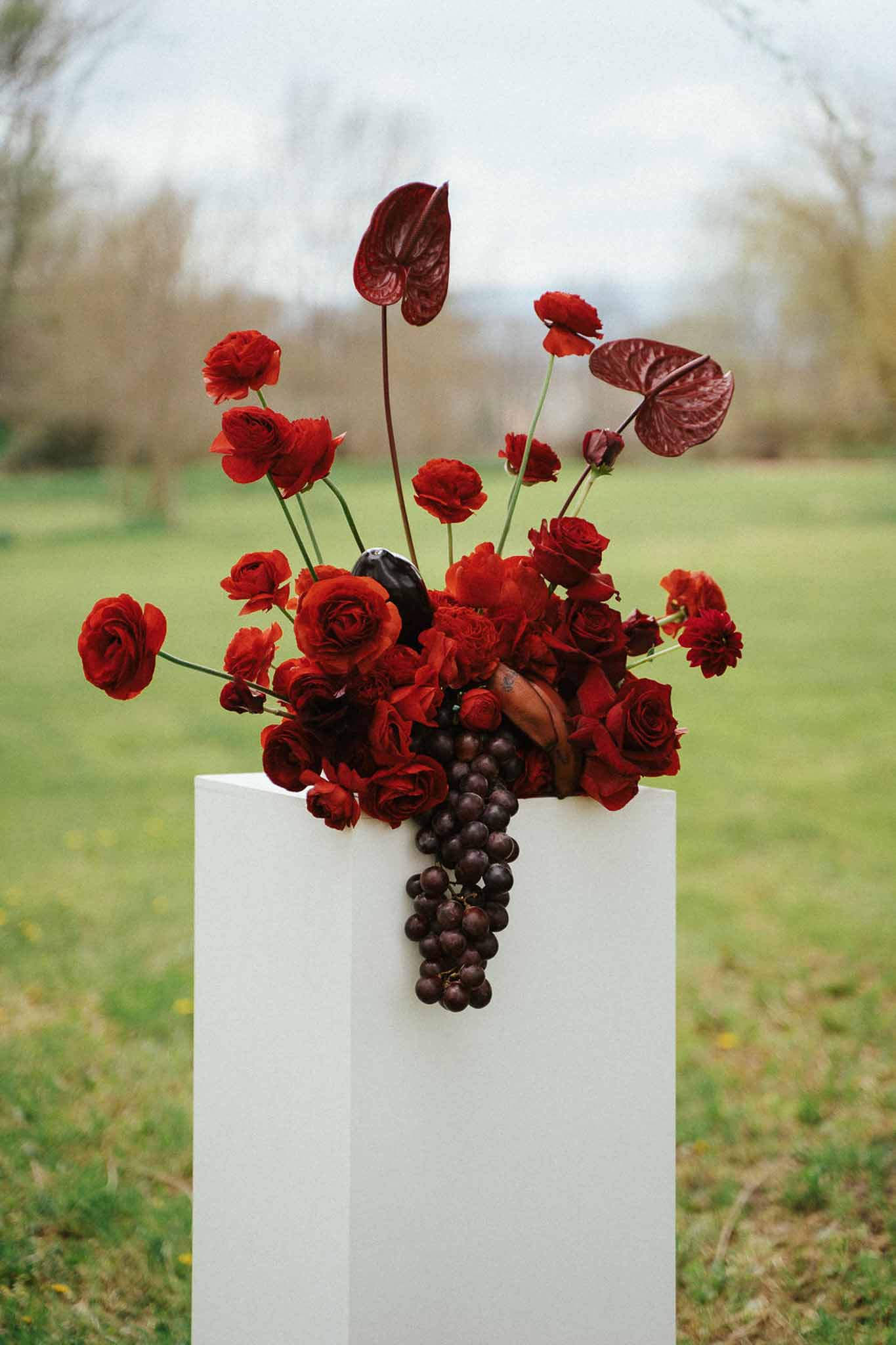 Wedding rings in a garden with white roses