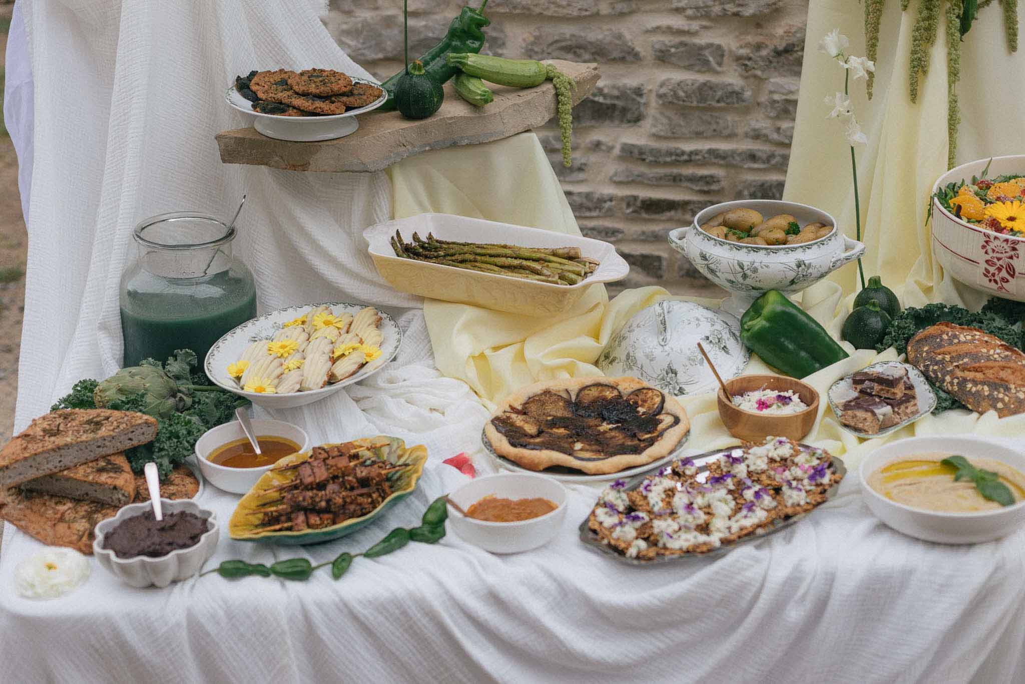 Mediterranean appetizer spread with grilled vegetables and flatbreads during cocktail hour at outdoor venue