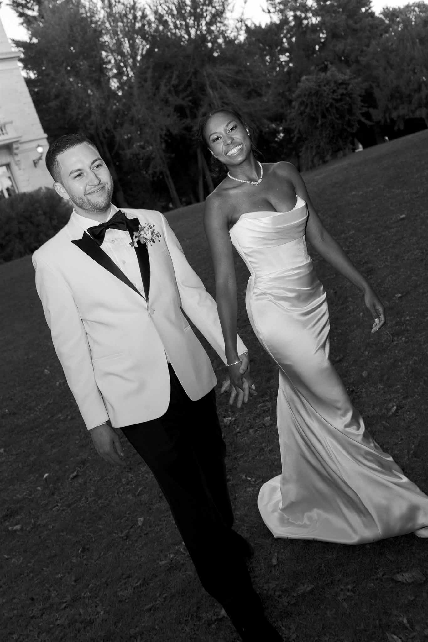 Bride and groom portrait in garden setting during wedding reception