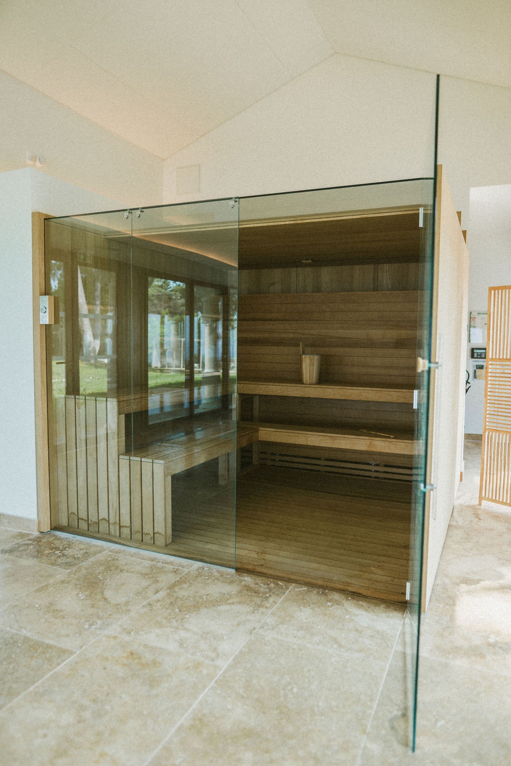 Glass-enclosed timber sauna in the spa pavilion at Domaine Rocabella, French Riviera