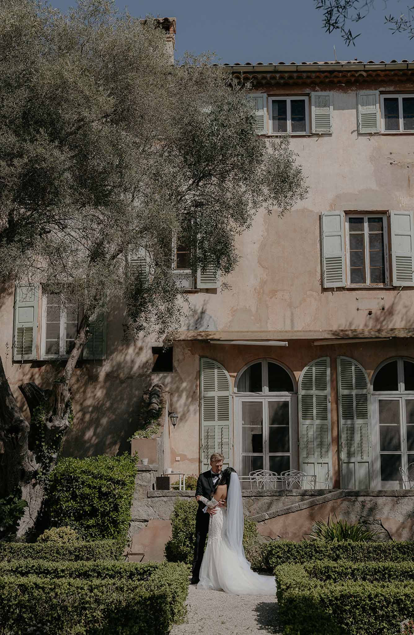 Bride and groom portrait in a garden